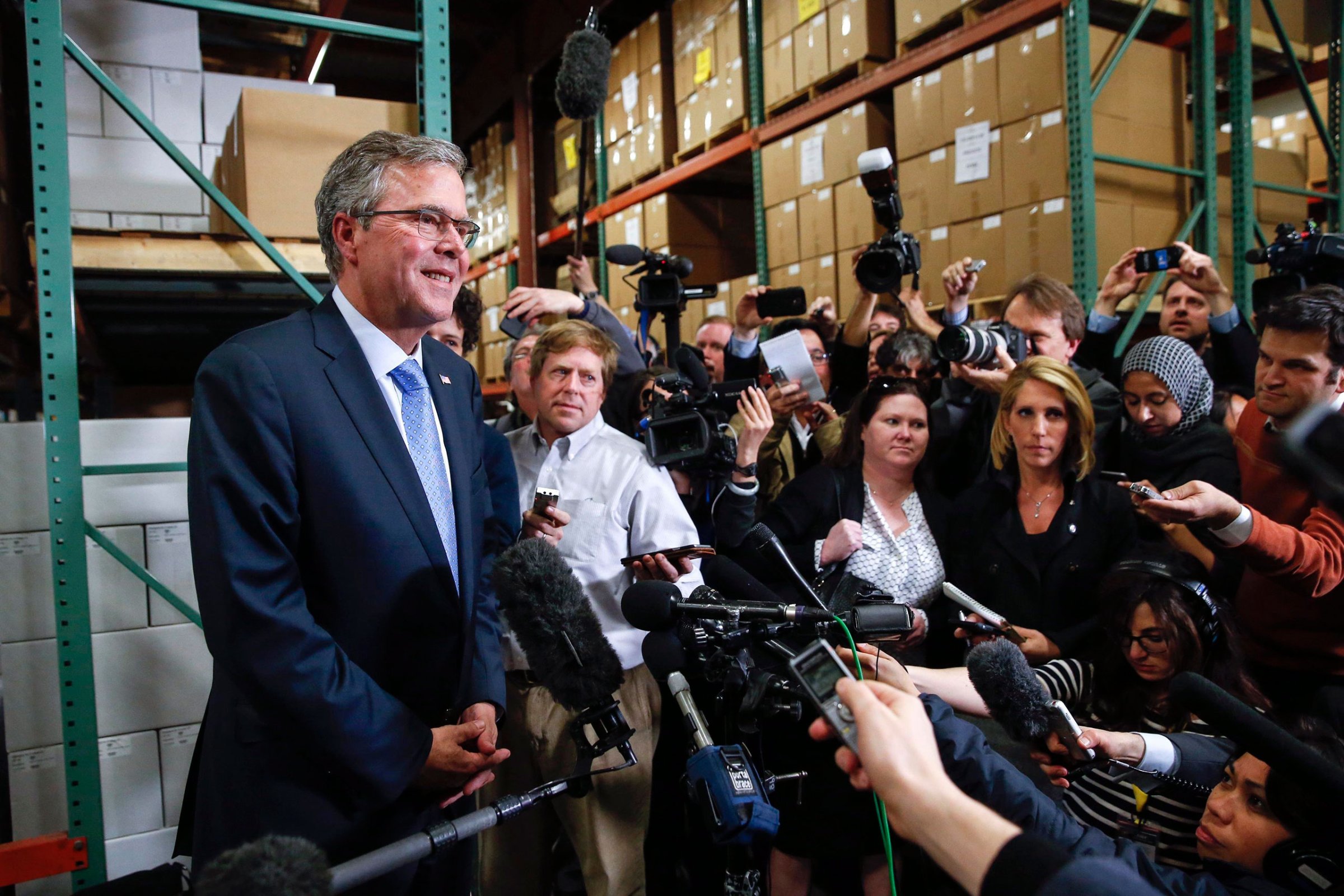 Former Florida Governor Jeb Bush speaks to the media after visiting Integra Biosciences during a campaign stop in Hudson, New Hampshire
