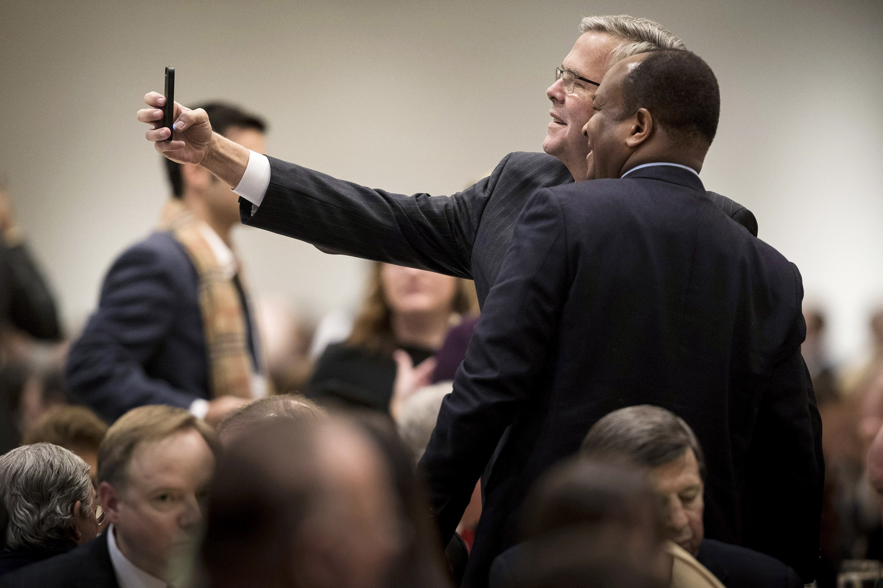 Jeb Bush with a fan at the Chicago Council on Global Affairs in February. (Andrew Nelles—The New York Times)