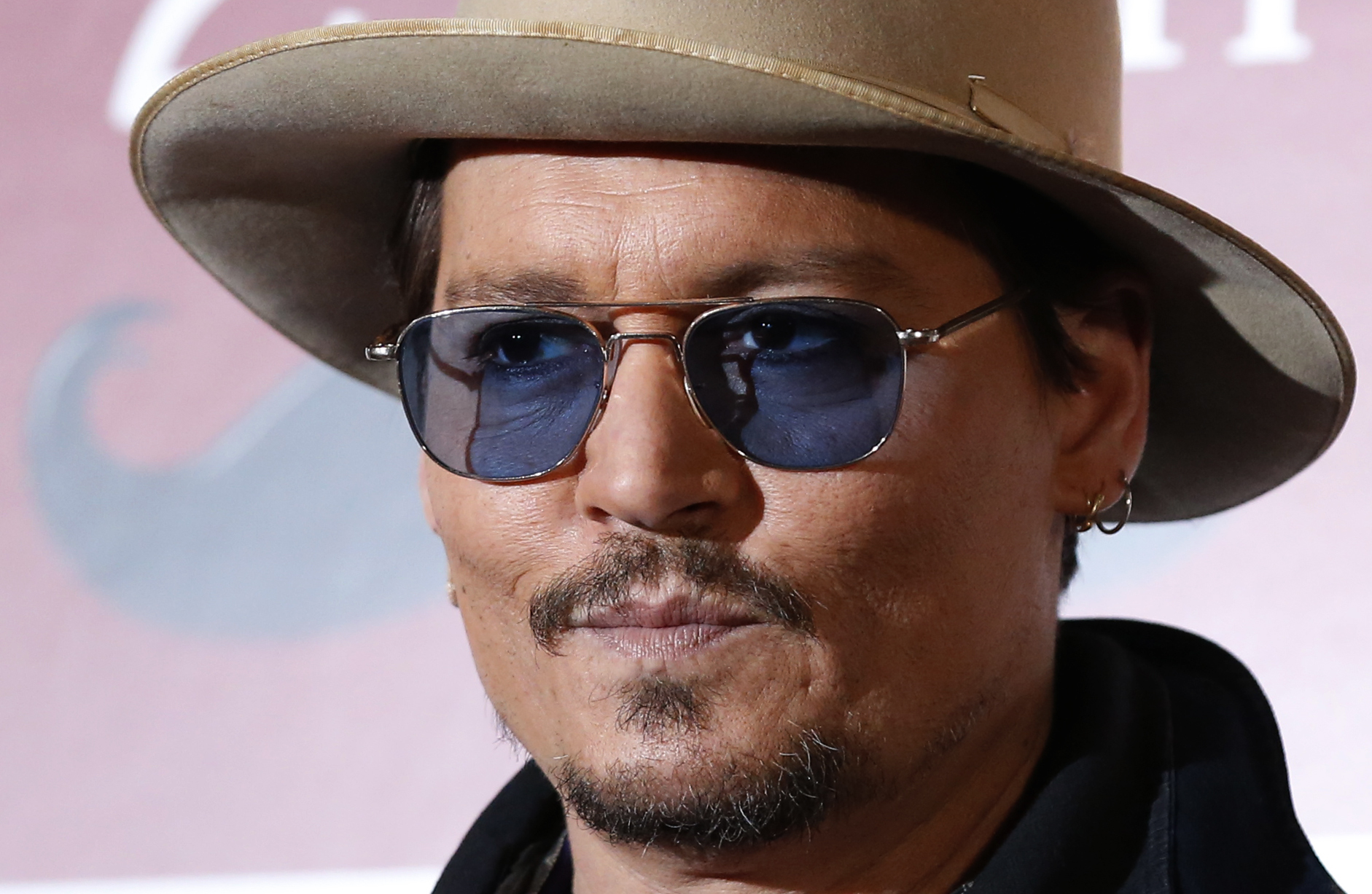 Actor Johnny Depp poses during a photo session ahead of a news conference for his movie <i>Mortdecai</i> in Tokyo on Jan. 28, 2015 (Toru Hanai—Reuters)