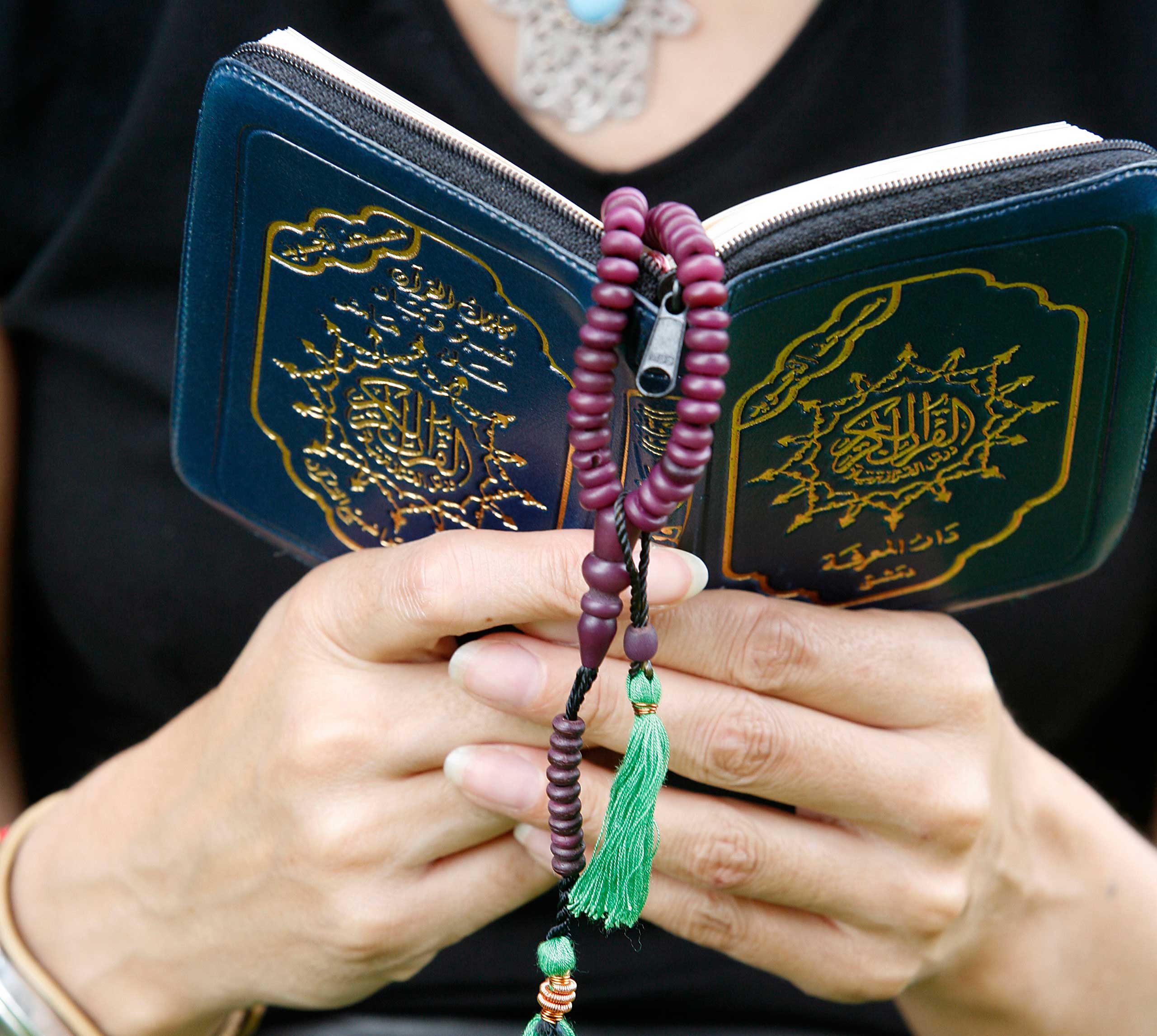 Woman reading the Koran.