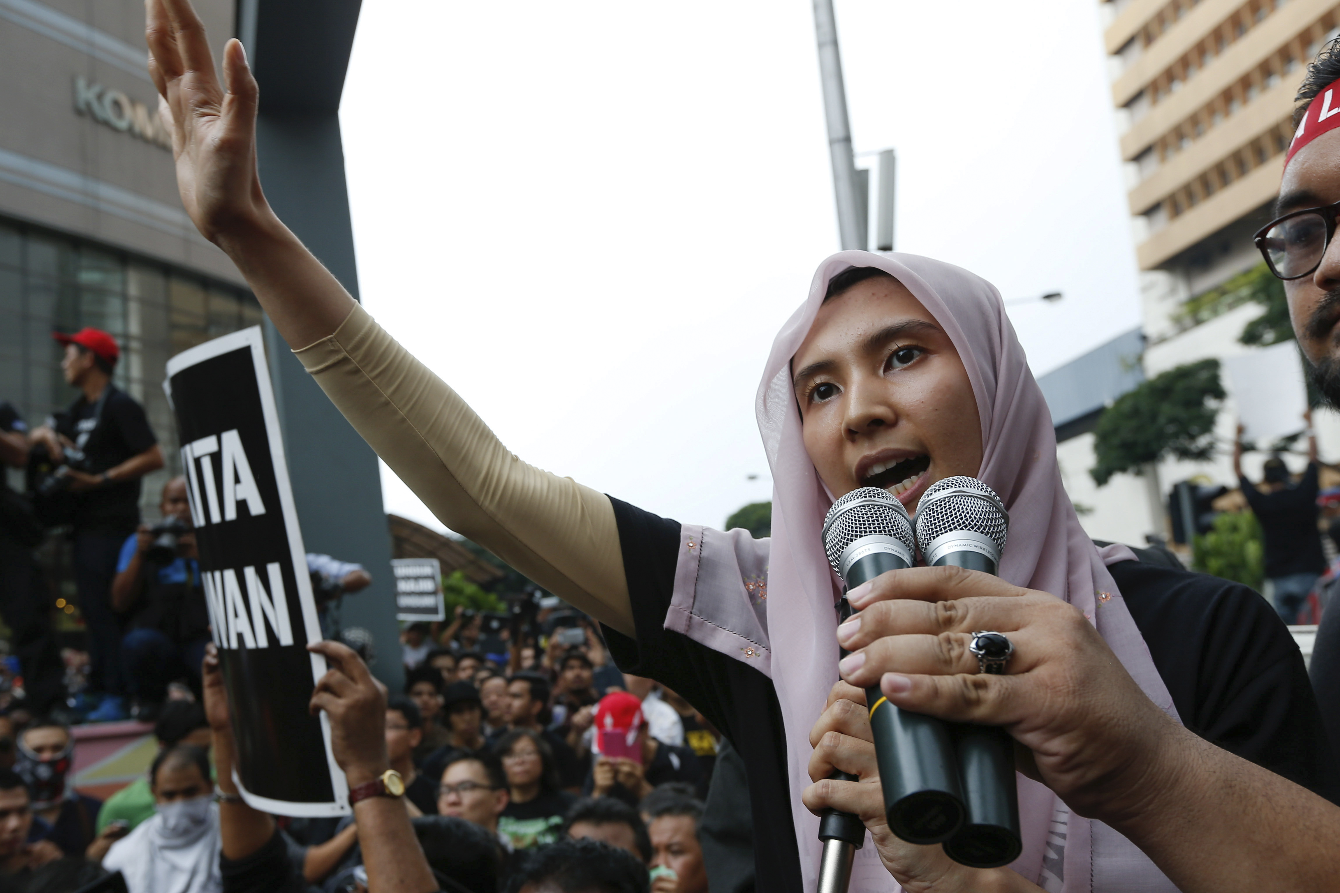 Lawmaker and a vice-president of the People's Justice Party Nurul Izzah Anwar, speaks to protesters as they gather to demand the freedom of her father, Anwar Ibrahim, in downtown Kuala Lumpur, March 7, 2015.