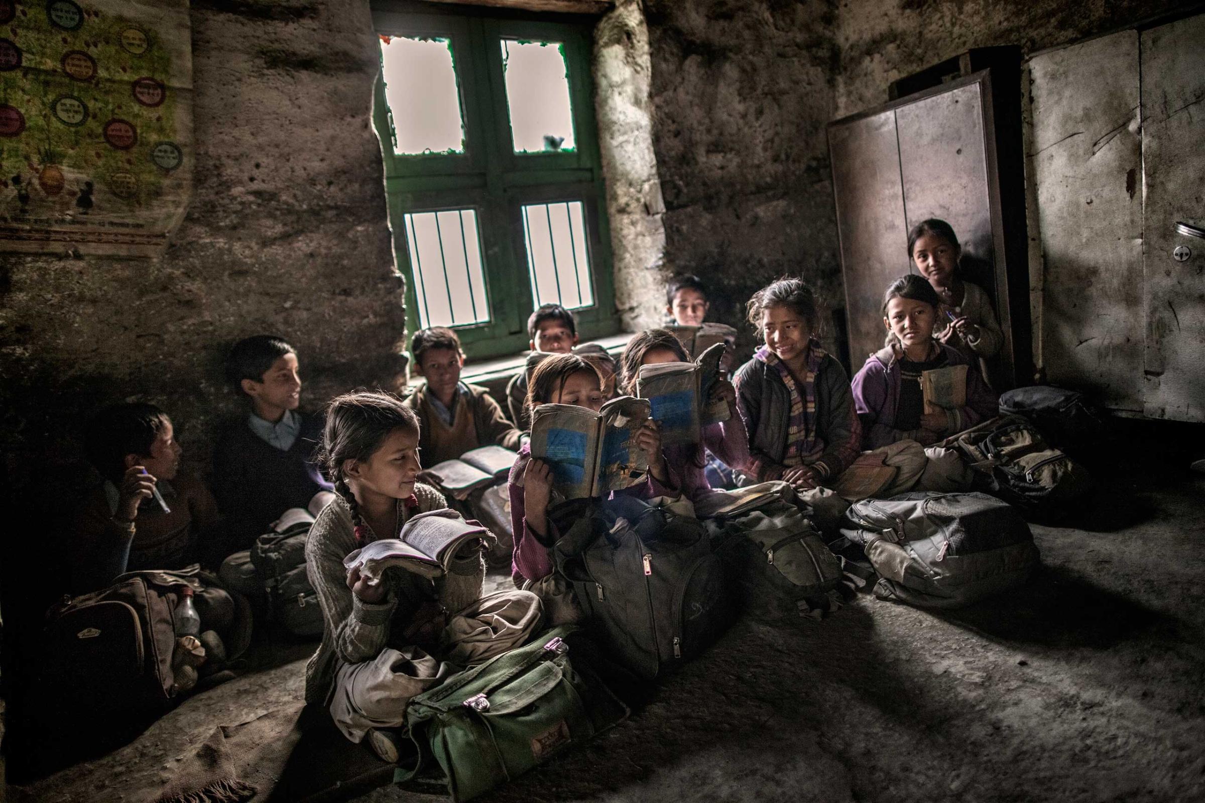 Young school children sit inside a classroom during a lesson in Dec. 2014.