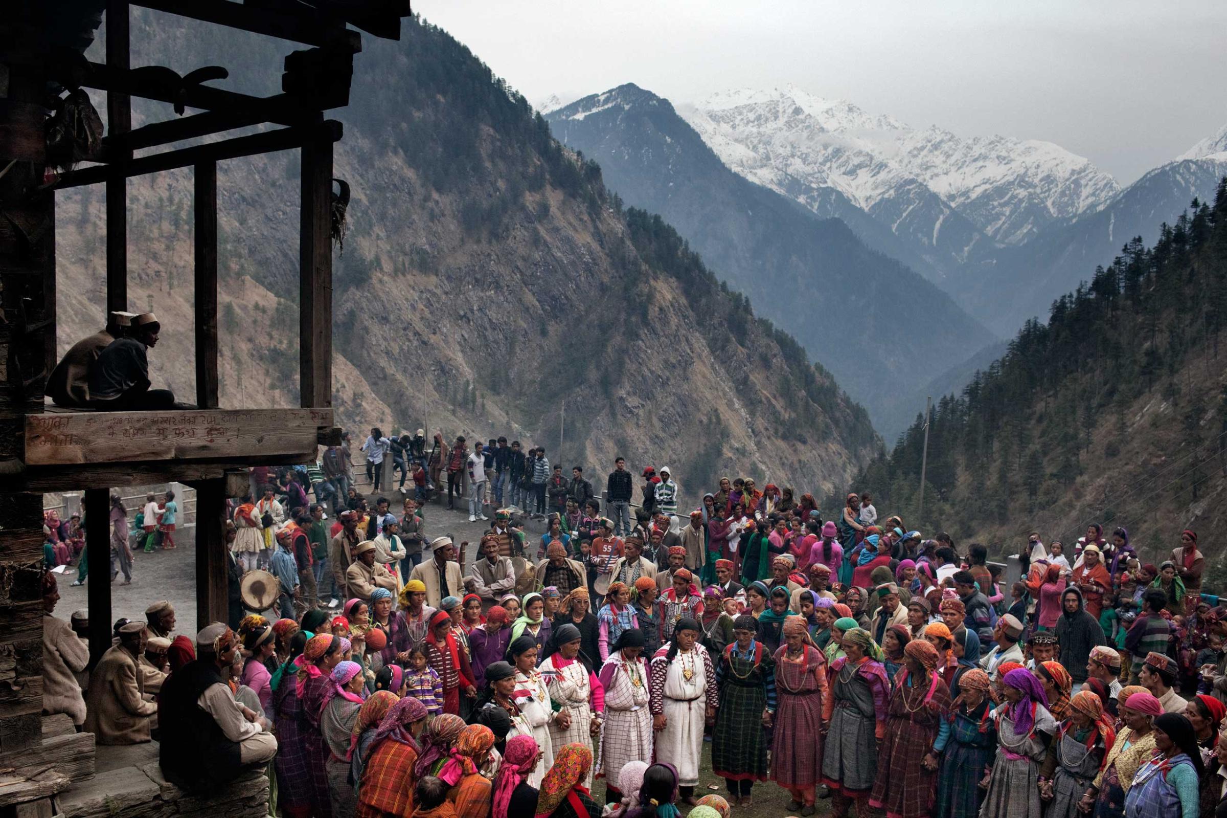 Villagers gather in the square during a celebration known as a 'mela' in which three different village come together in April 2013.