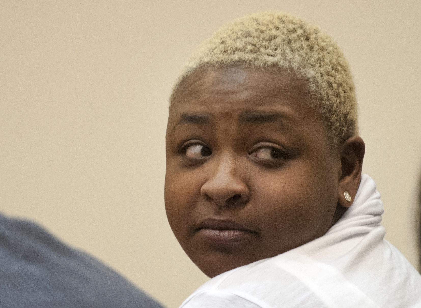 Shaneka Monique Torres looks around the courtroom before being found guilty on all charges related to her shooting a gun into a McDonald's when she failed to get bacon on her burger, Wednesday, March 25, 2015, in Grand Rapids, Mich