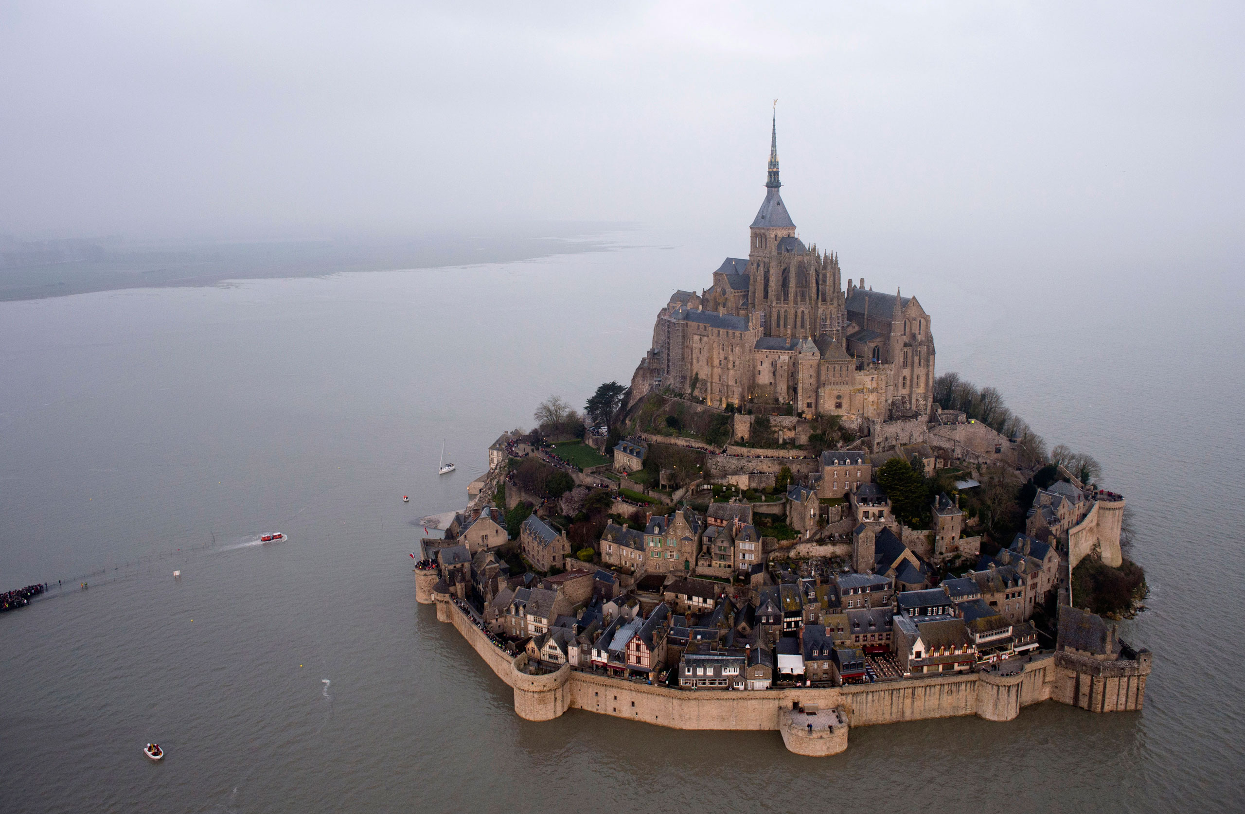 An aerial view as a "supertide" submerges a narrow causeway leading to the Mont Saint-Michel, on France's northern coast, March 21, 2015. (AP)