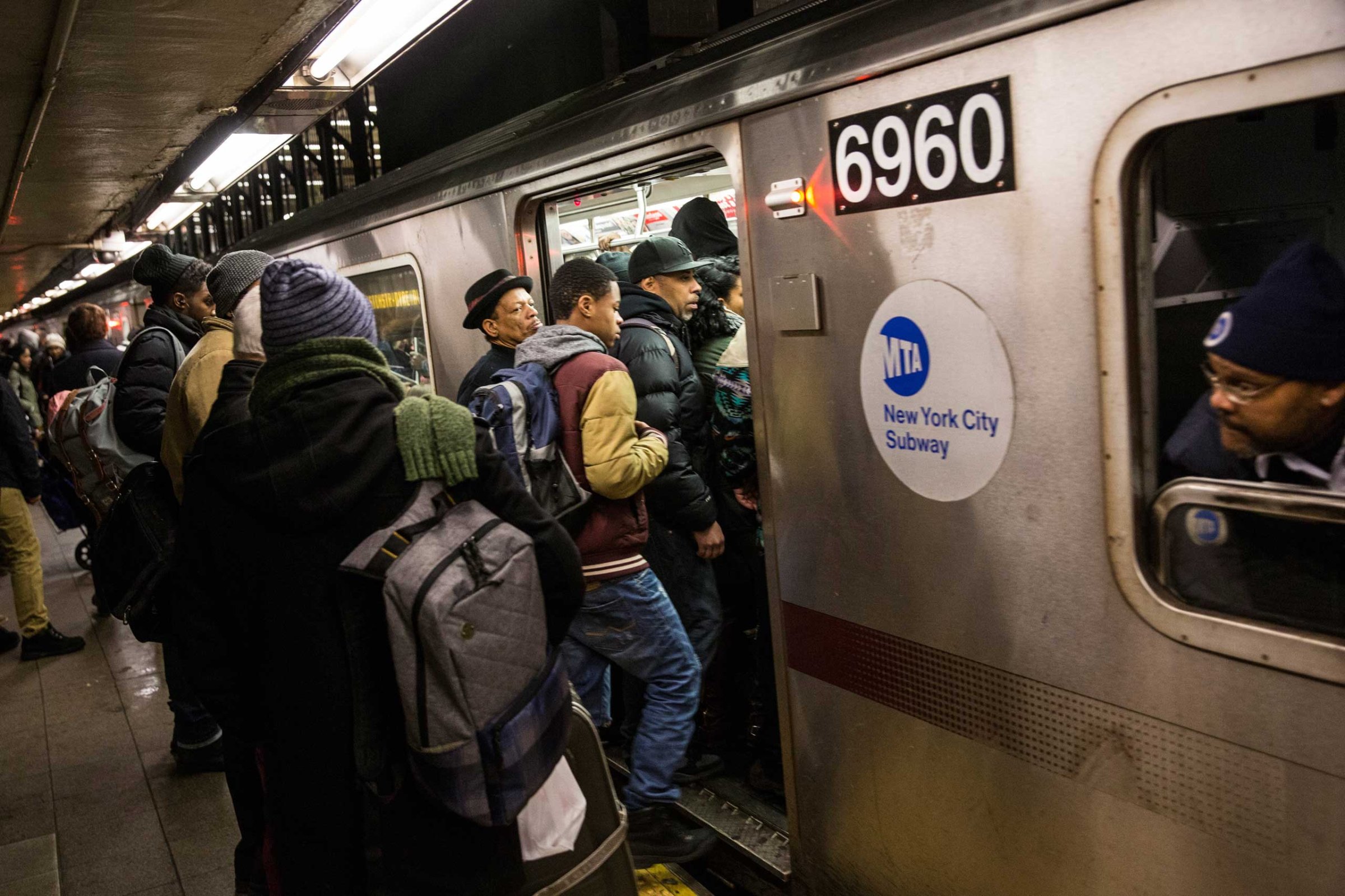 People board an uptown 5 train at Union Square on Jan. 28, 2015 in New York City.