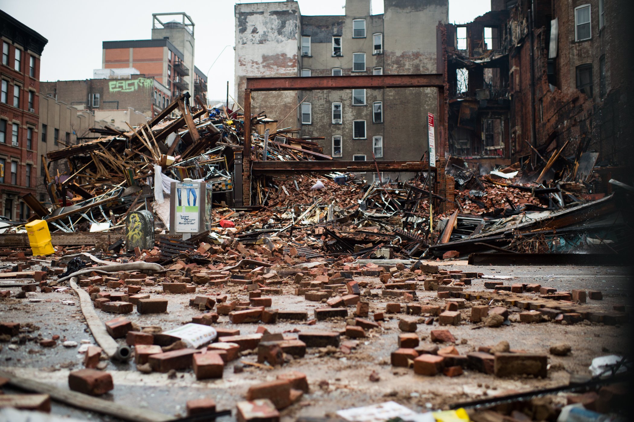 A debris-strewn street seen amid the site of a seven-alarm fire that caused the collapse of two buildings and damage to two other buildings a day after the blaze took place on March 27, 2015 in New York City.