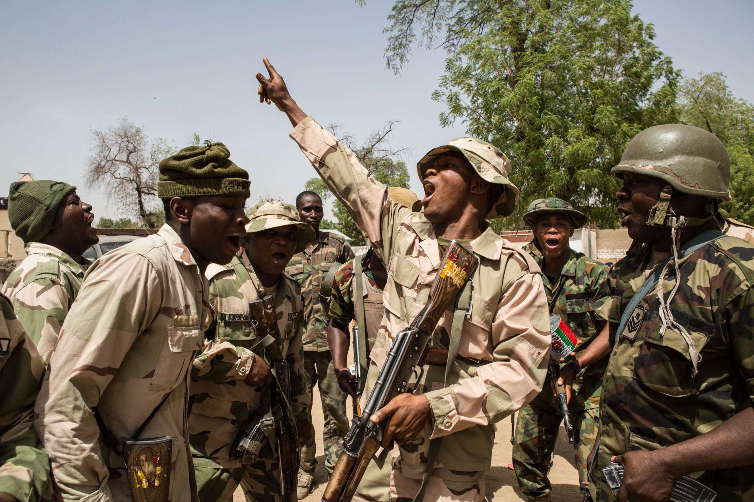 Nigerian troops celebrate after taking over Bama from Boko Haram on March 25, 2015.