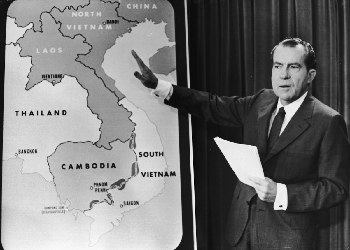 Richard Nixon points to a map of Southeast Asia during a nationwide broadcast (Hulton Archive/Getty Images)