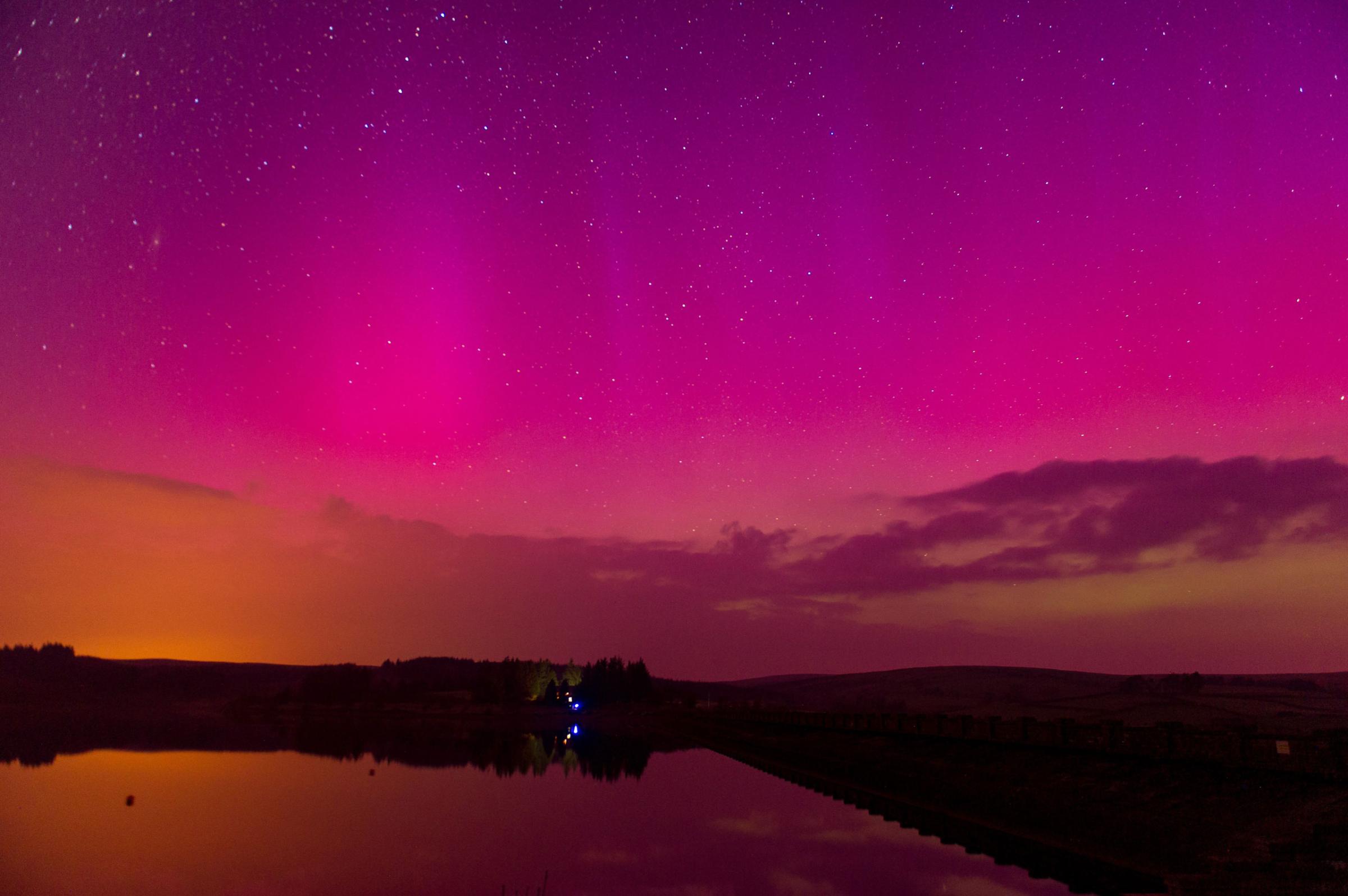 The Northern Lights are seen over Usk Reservoir at the Brecon Beacons, Wales, on March 17, 2015.