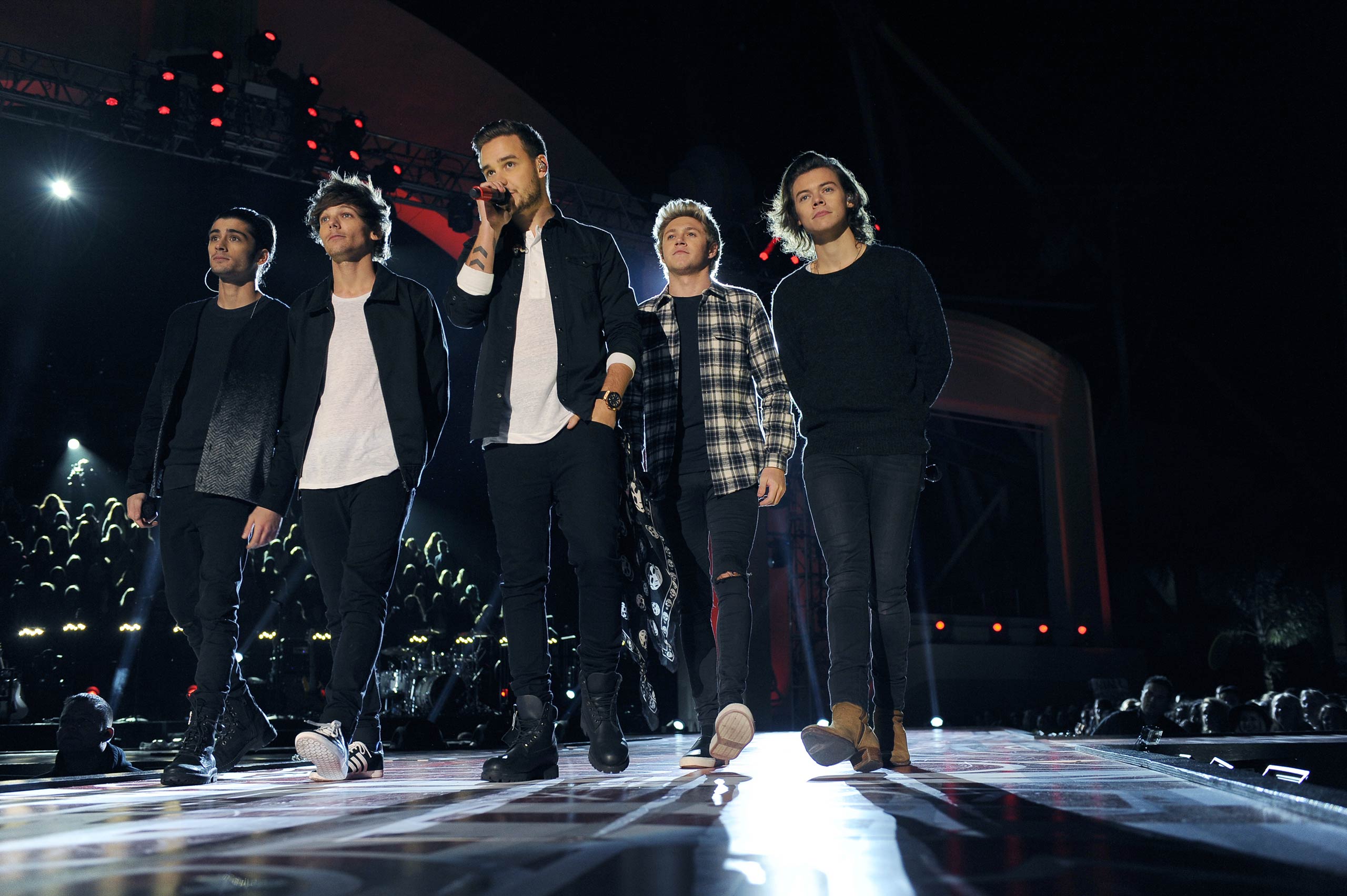 Zayn Malik, Louis Tomlinson, Liam Payne, Niall Horan and Harry Styles on the One Direction TV special in 2014.