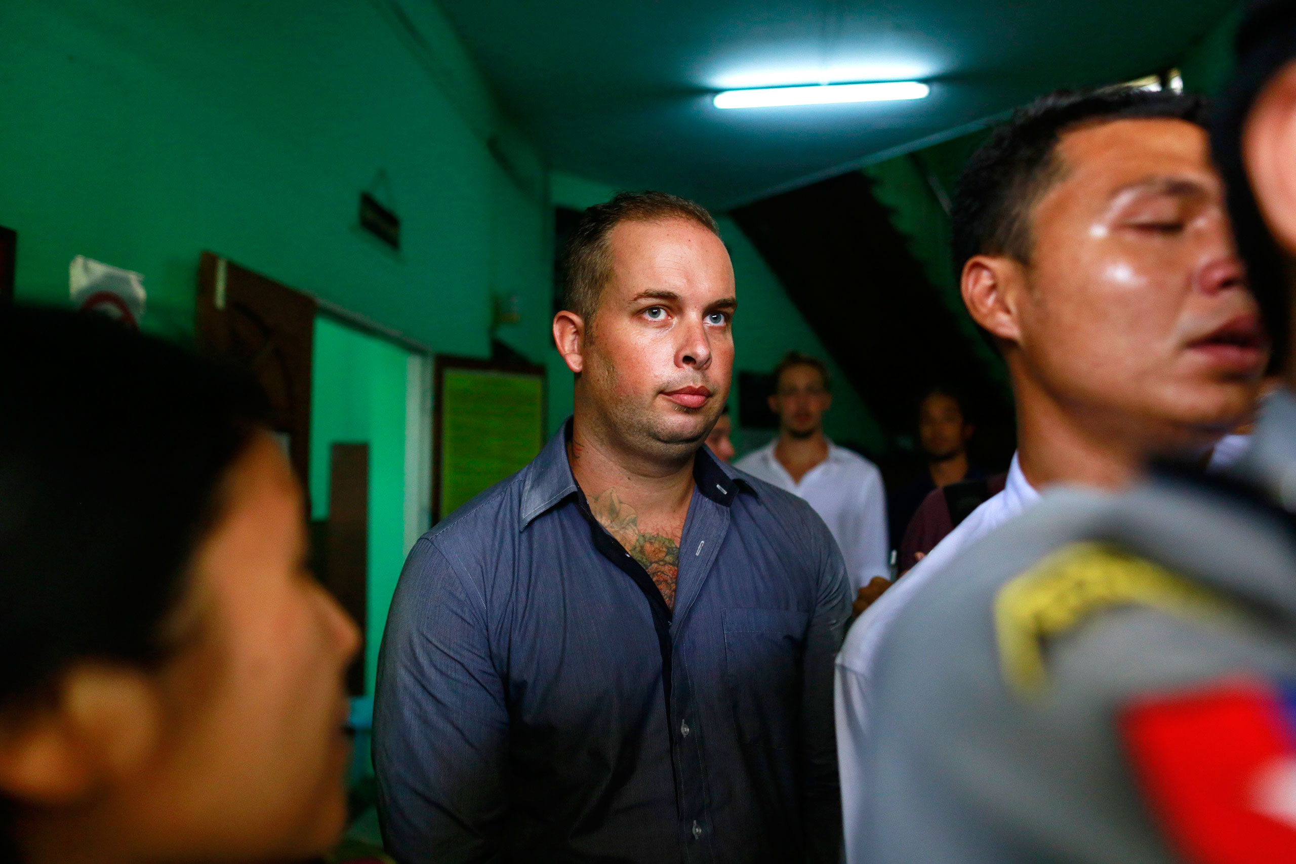 Phil Blackwood, a bar manager from New Zealand, comes out of court after being sentenced to two and half years in prison, at Bahan township court in Yangon on March 17, 2015.