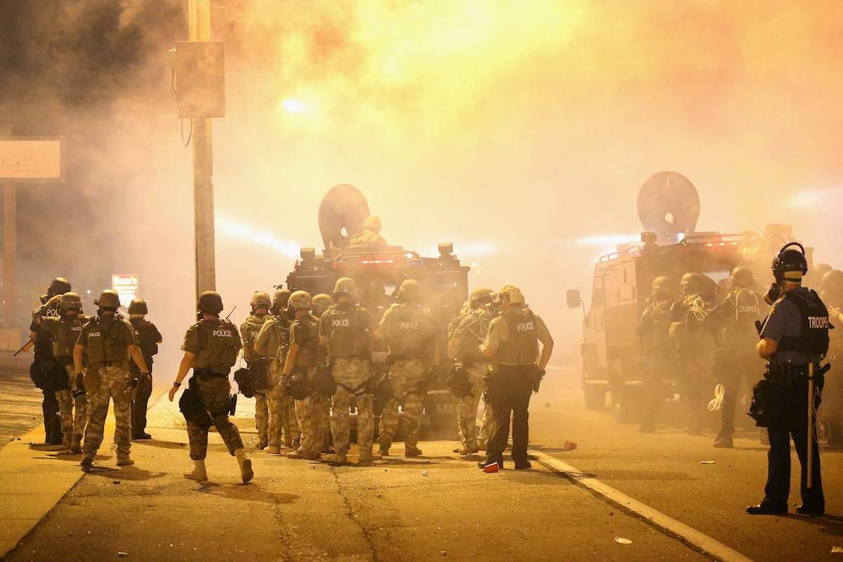 Police advance through a cloud of tear gas on Aug. 17, 2014 in Ferguson, Mo. (Scott Olson—Getty Images)