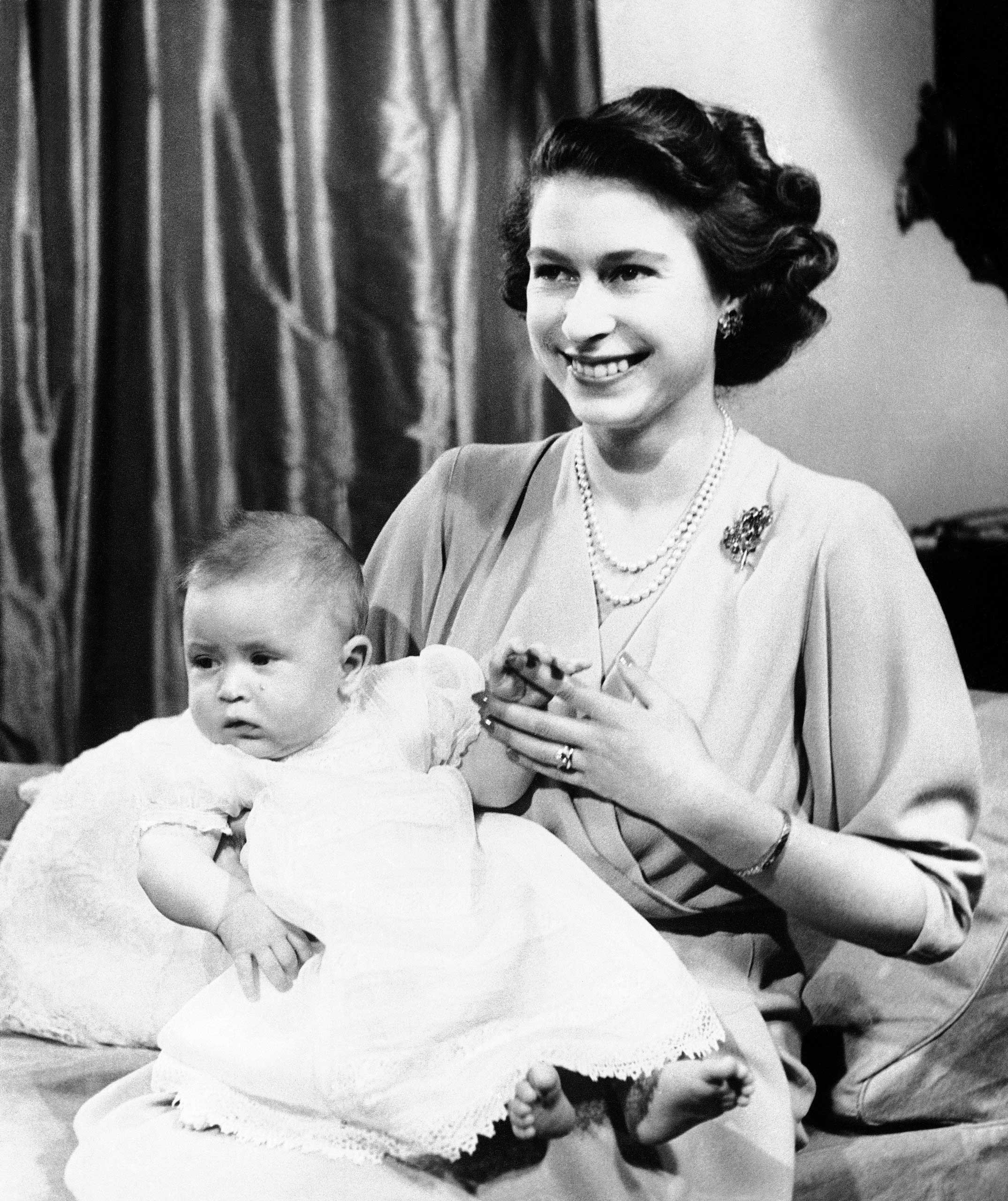 Before Princes Charles was born in 1948, his grandfather King George VI did away with a long-held custom that demanded the Home Secretary be present at royal births. Here Charles is pictured with his mother, at that stage still Princess Elizabeth.