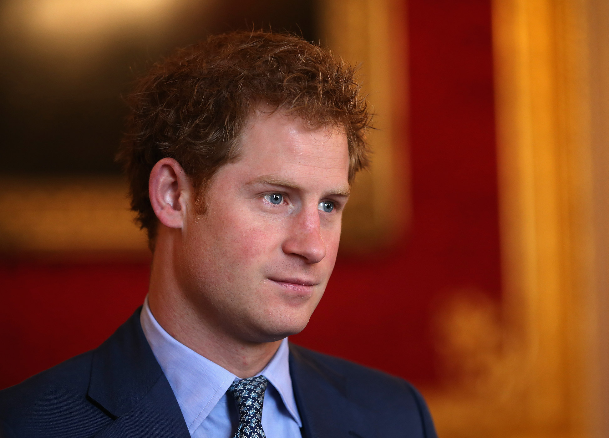 Prince Harry chats with Coach Core graduates during a Coach Core Graduation event at St James's Palace on Jan. 14, 2015 in London, England. (Chris Jackson—Getty Images)