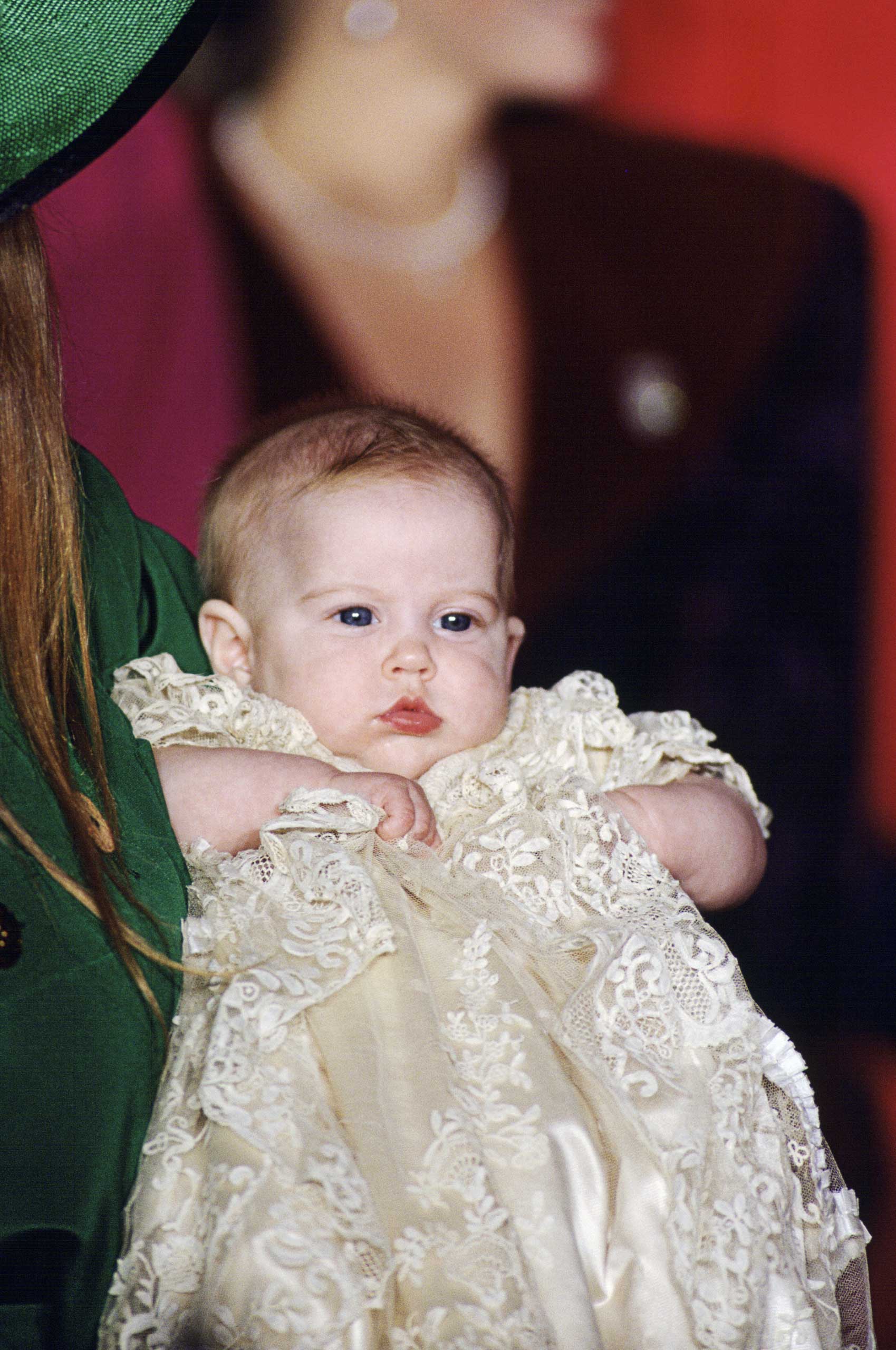 The spitting image of her dad Prince Andrew, but for the red hair inherited from mother Sarah, Duchess of York, Princess Beatrice looks pensive at her 1988 christening.