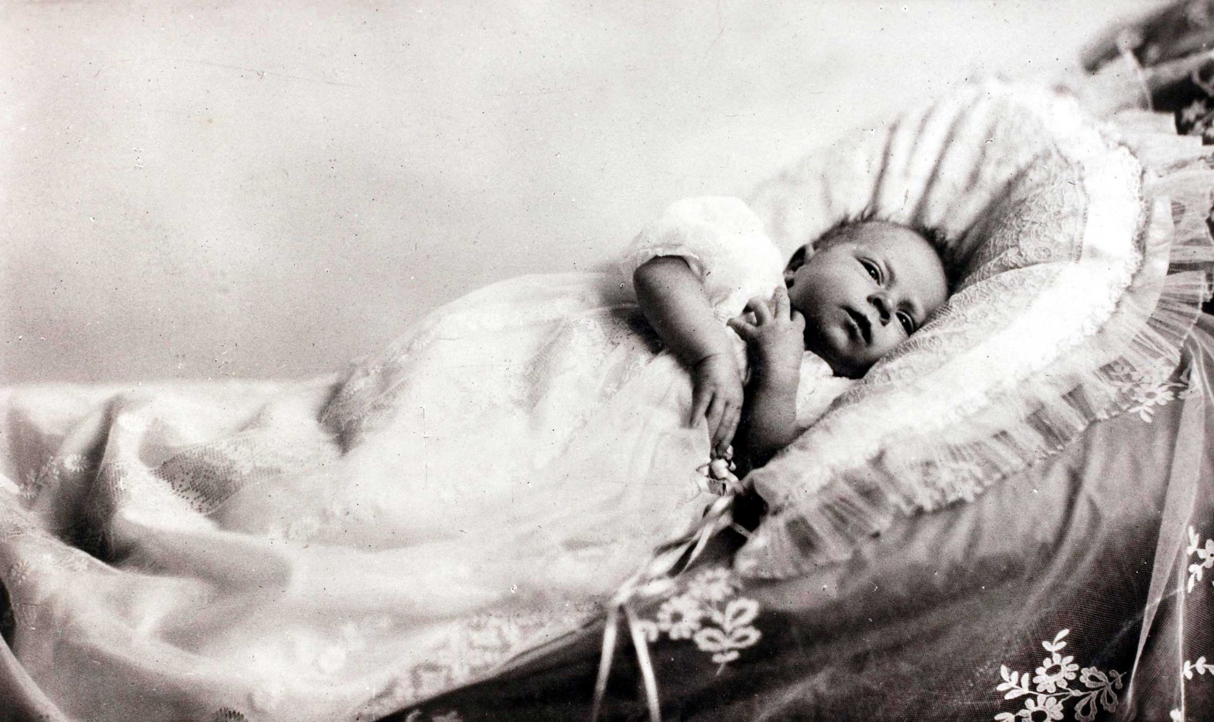 In 1926, as a tiny baby, Princess Elizabeth already displays the solemn face that she has deployed so often in her public duties since becoming Queen.