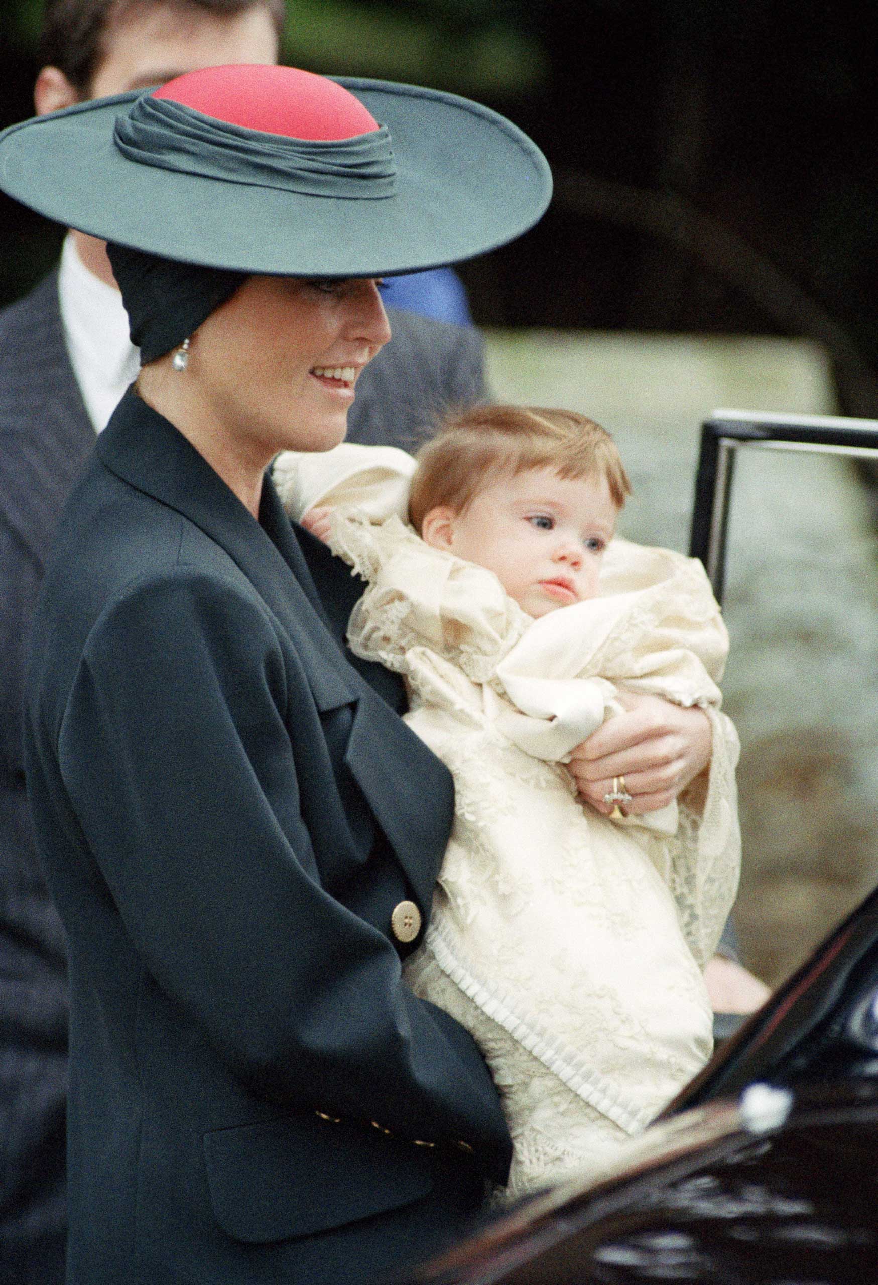 Another addition to the house of York: Princess Eugenie, with her mother Sarah, at her christening in 1990.