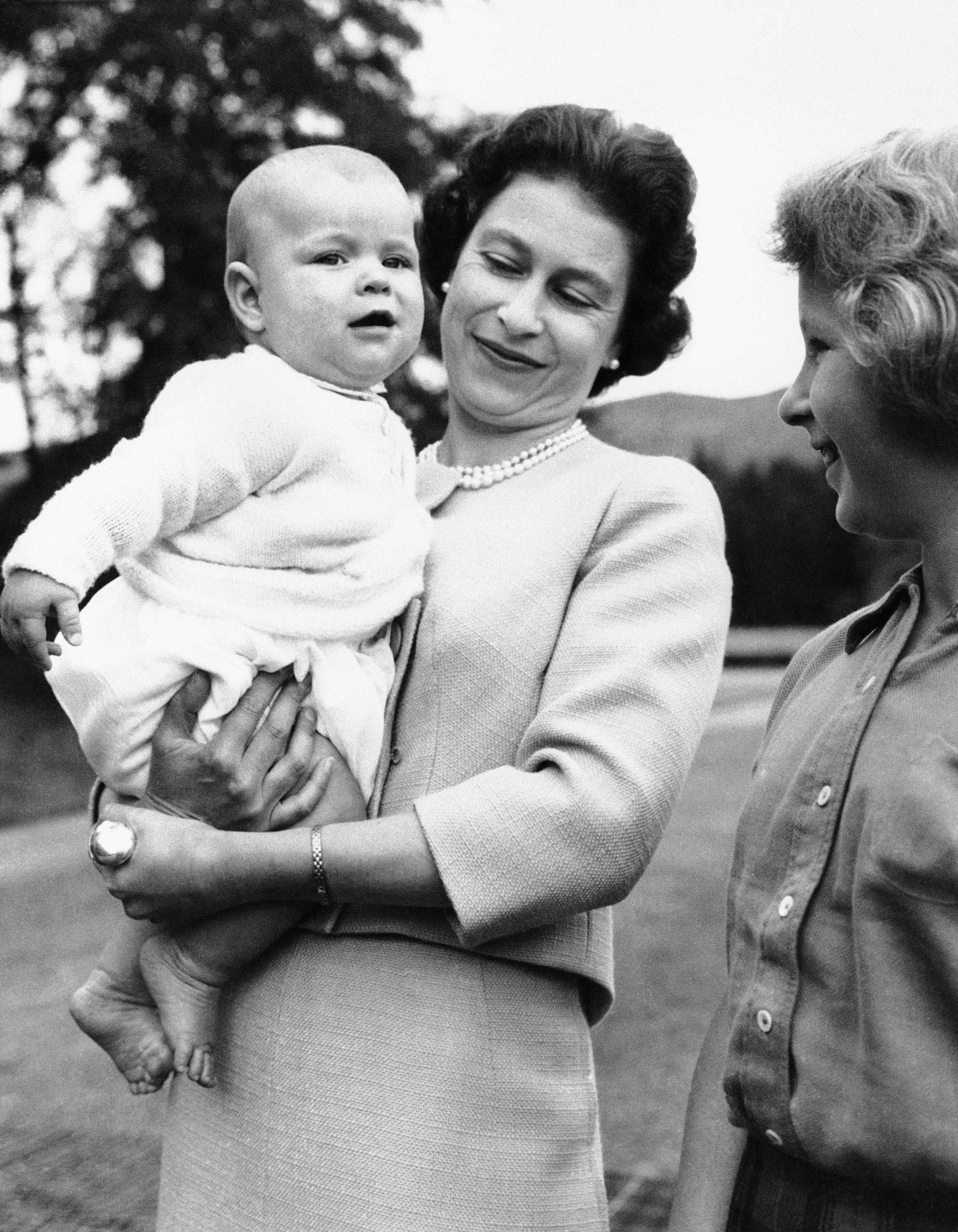She already had an heir. Here's Queen Elizabeth with the spare: a chubby, 6-month-old Prince Andrew, in the grounds of Balmoral Castle, Scotland in 1960.
