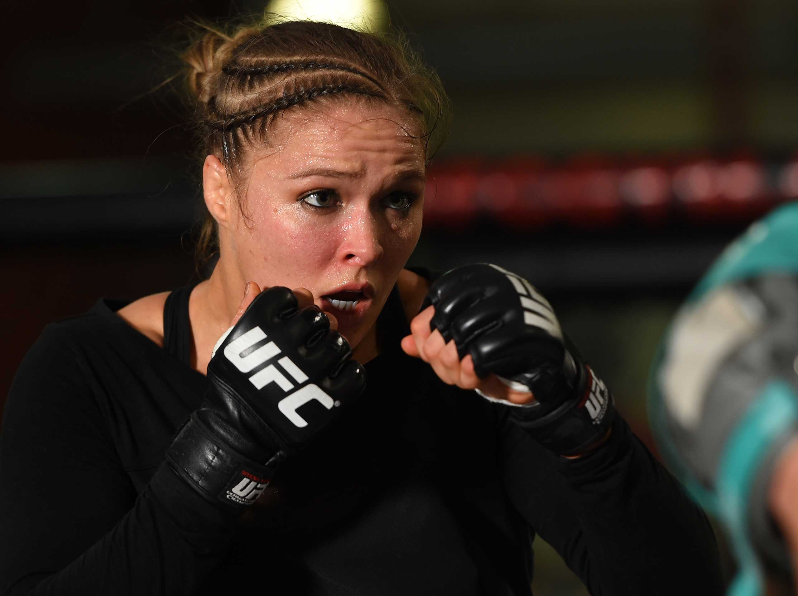 UFC women's bantamweight champion Ronda Rousey holds an open training session for fans and media at the UFC Gym in Torrance, Calif. on Feb. 24, 2015. (Josh Hedges—Zuffa/Getty Images)