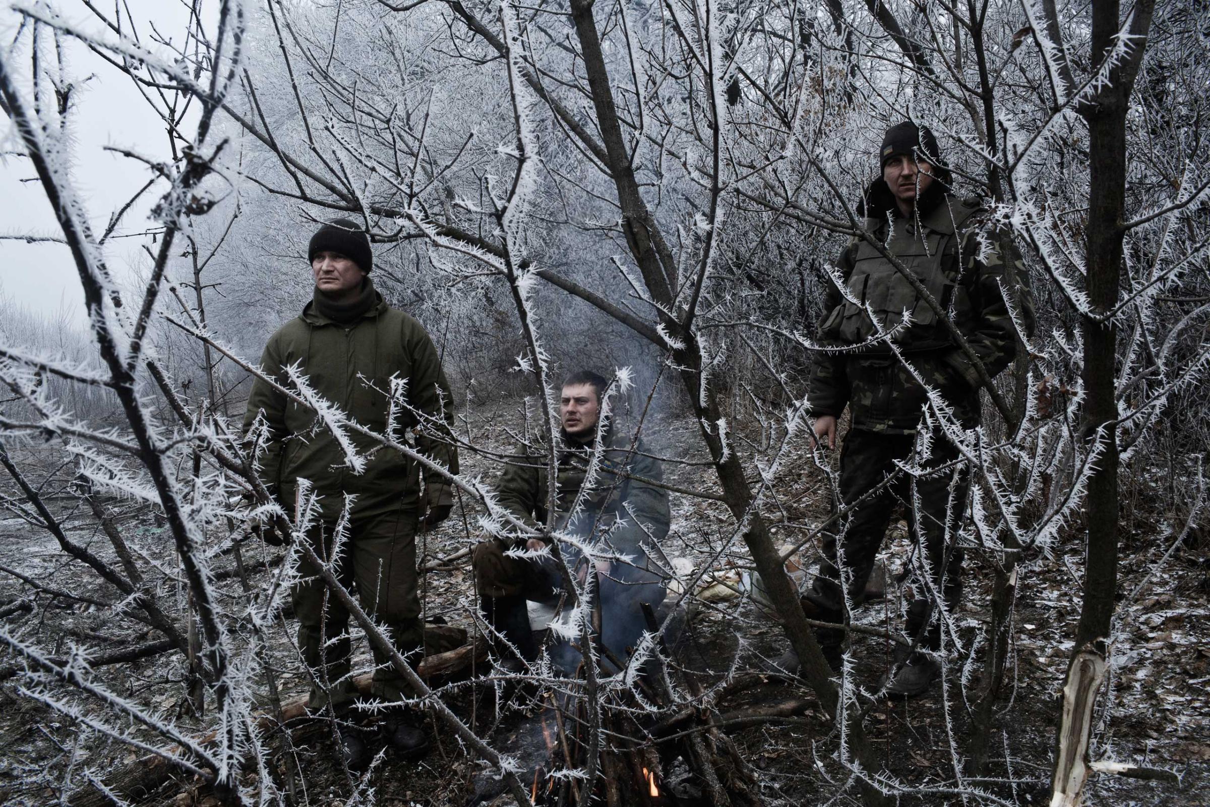 Ukrainian soldiers conduct operations along the road in Artemivsk, Ukraine, Feb.15, 2015.
