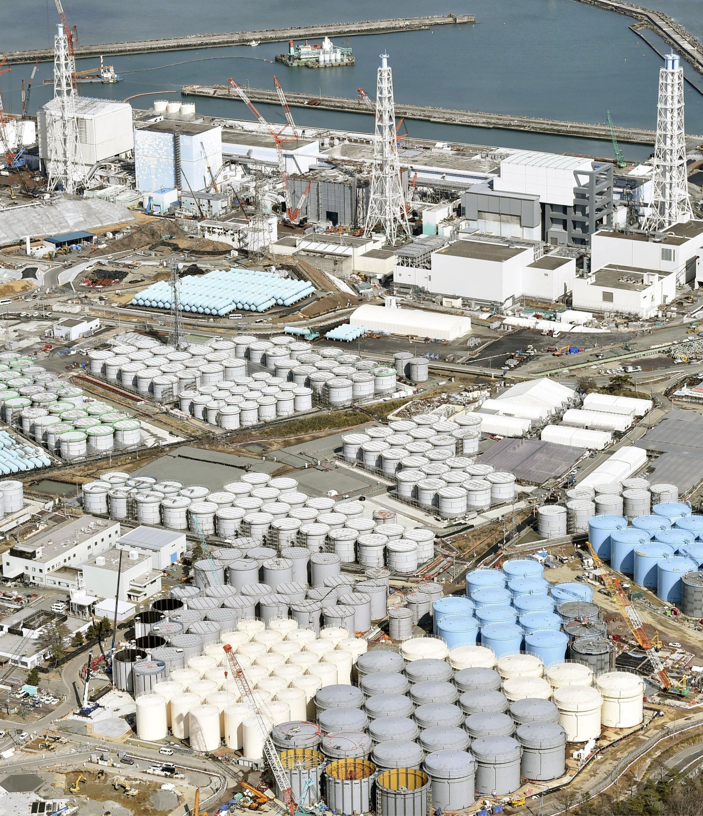Tanks of radiation-contaminated water are seen at Tokyo Electric Power Co. (TEPCO)'s Fukushima Daiichi nuclear power plant in Fukushima, Japan on March 11, 2015.