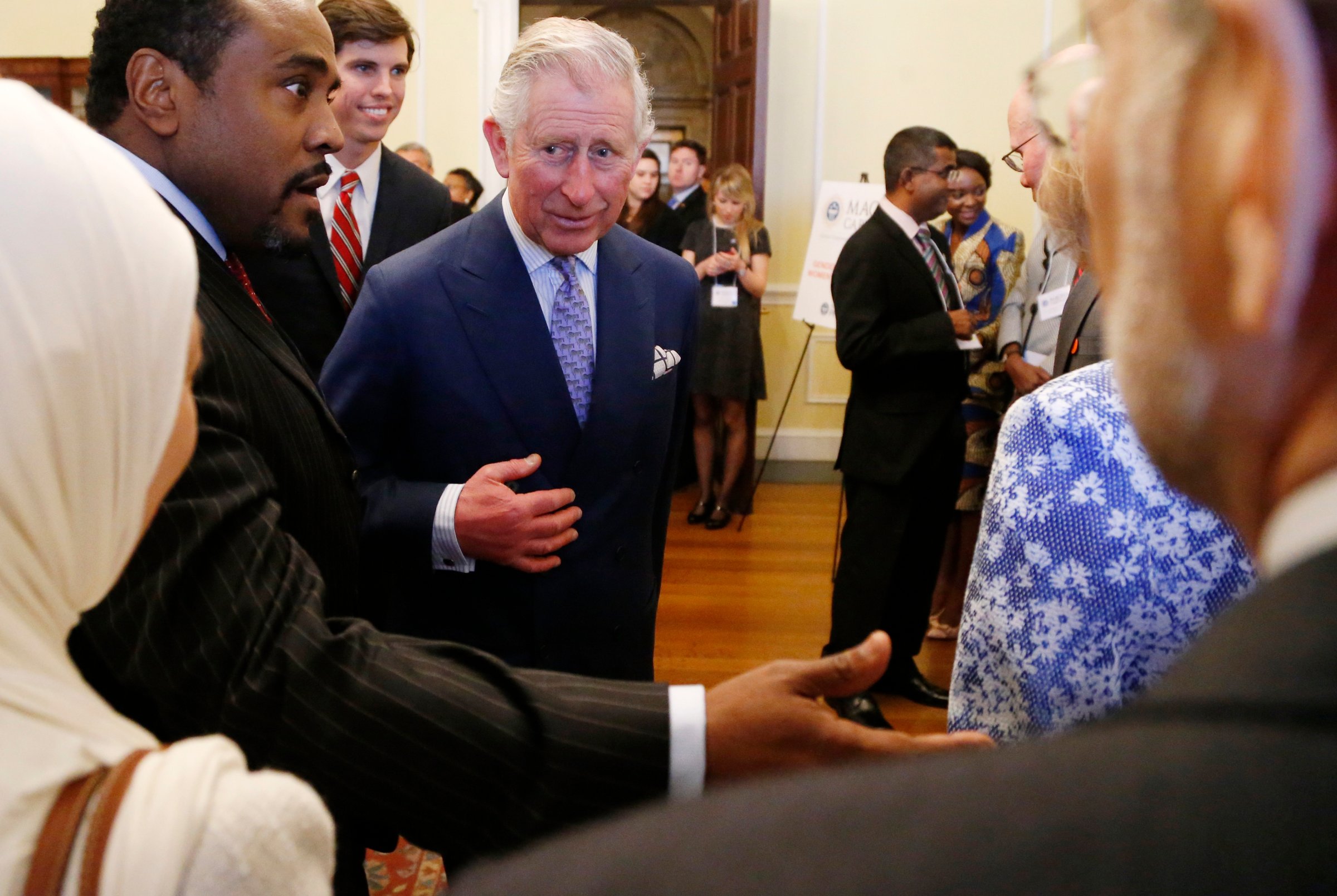 Britain's Prince Charles greets participants in a conference about the rule of law in the 21st century as he visits the National Archives in Washington