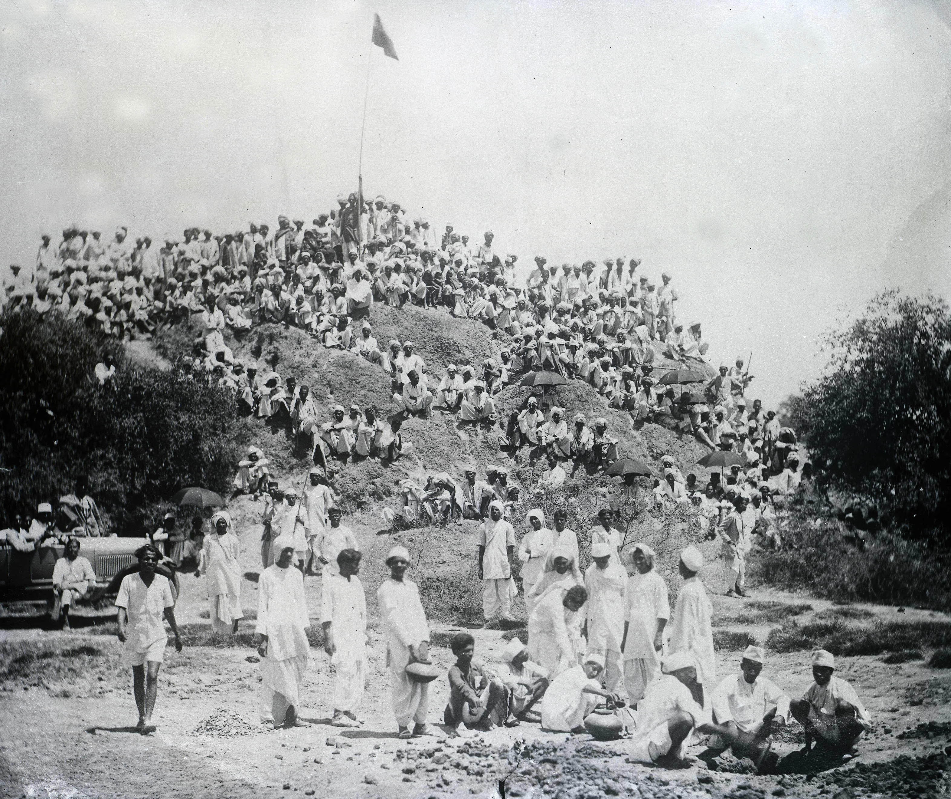 Protestors watching members of their band making salt following the civil disobedience riots and demonstrations demanding the boycotting of British goods and the arrest of leader Mahatma Gandhi in Kapadwamj, India on May 6, 1930. (Popperfoto&mdash;Getty Images)