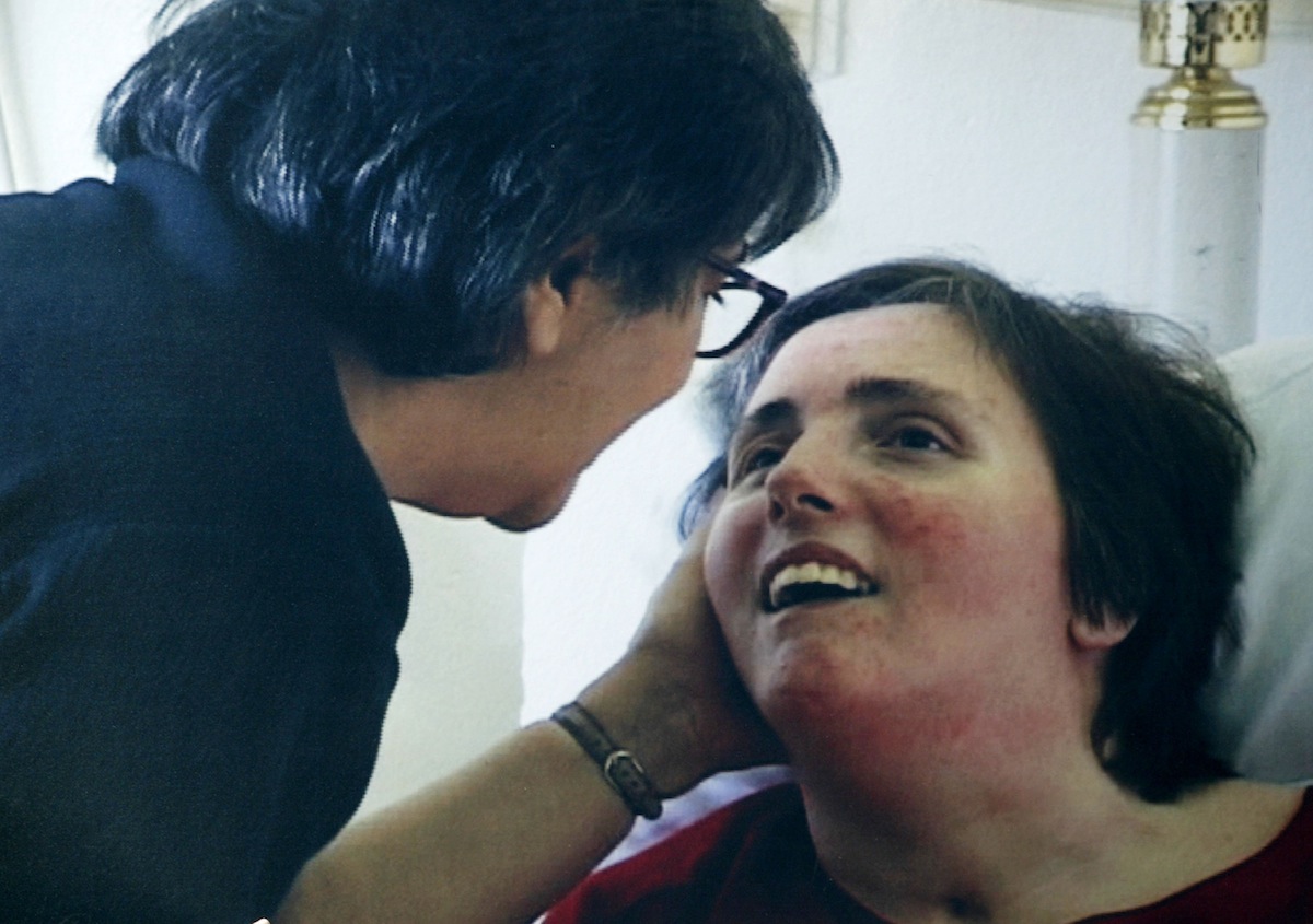 A family photo of Terri Schiavo, taken at Terri's hospital bed in 2003 in Gulfport, Fla., as seen on a protester's sign. (Matt May / Getty Images)