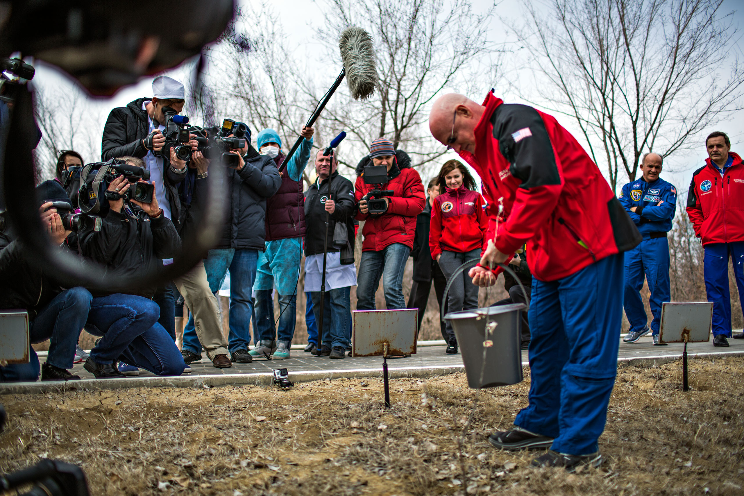 Scott Kelly waters the tree planted in his name in Baikonur, Kazhakstan on Saturday, March 21.