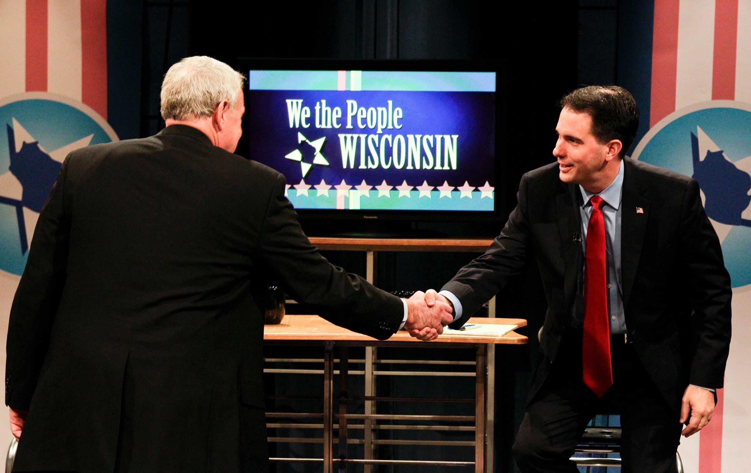 Wisconsin Governor candidates Milwaukee Mayor Tom Barrett, left, and Milwaukee County Executive Scott Walker greet each other before their final debate in Madison, Wis., on Oct. 29, 2010.