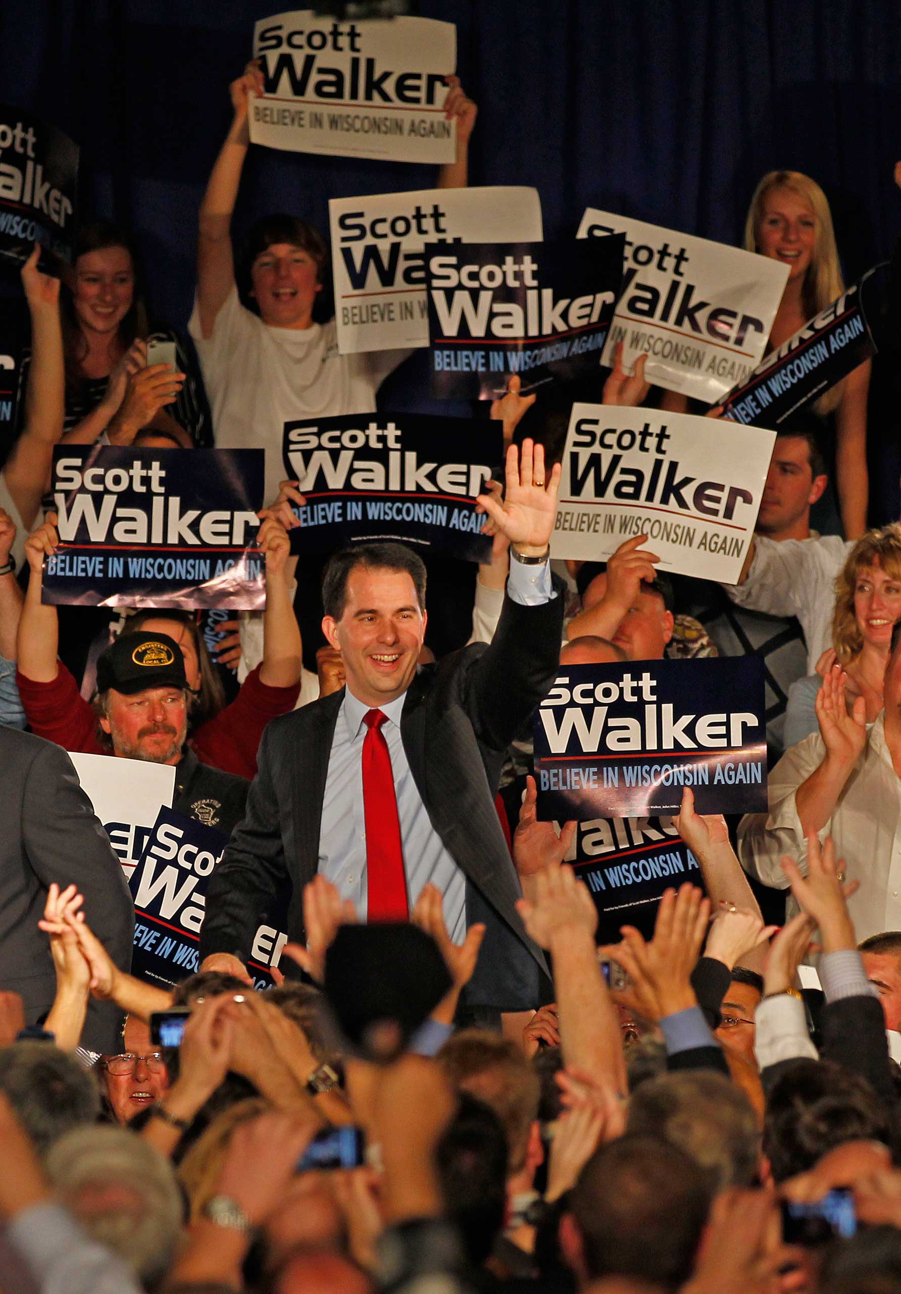 Supporters cheer as Wisconsin Republican gubernatorial candidate Scott Walker enters his victory party, in Pewaukee, Wisc., on Nov, 2, 2010.