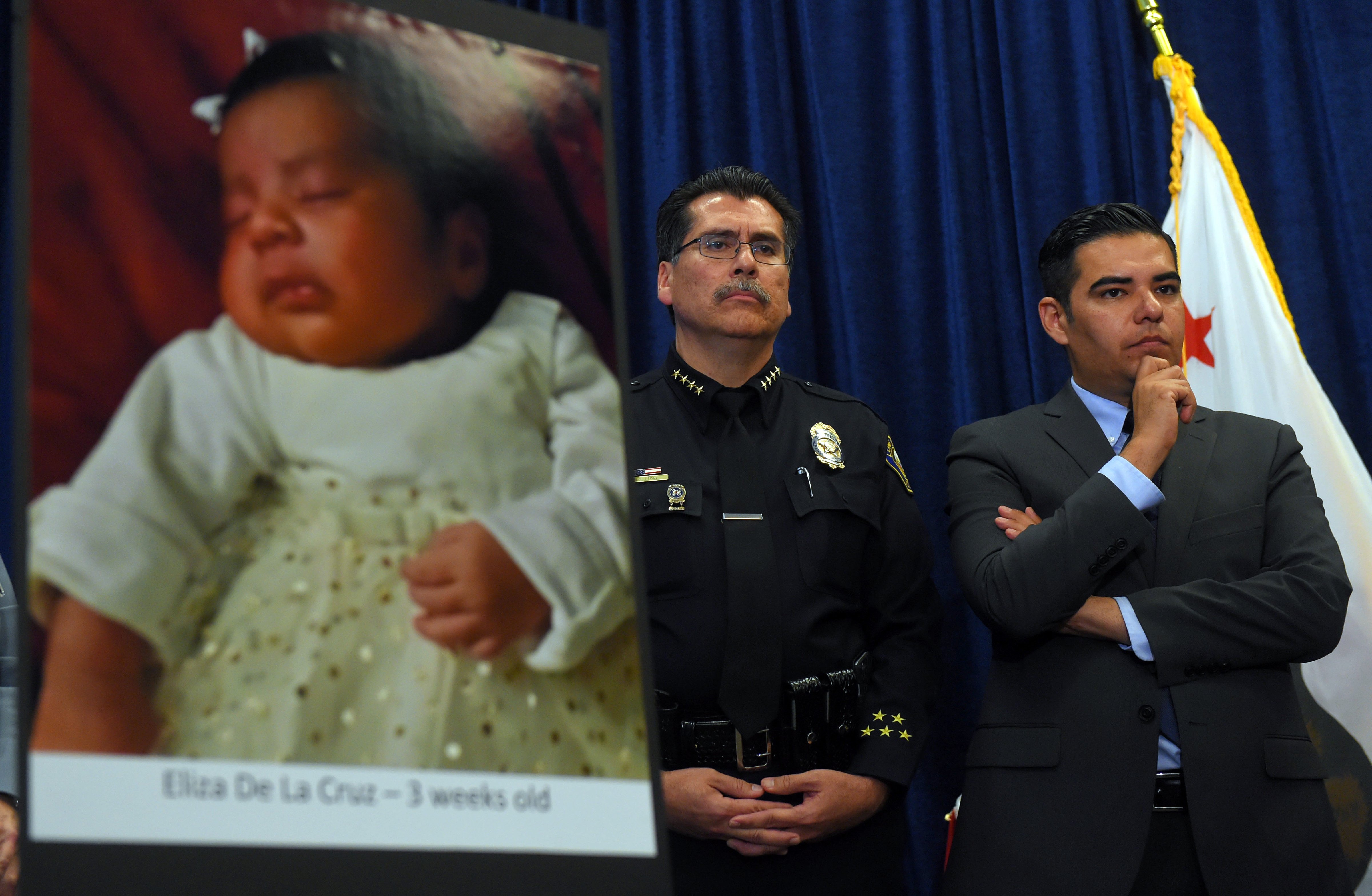 Long Beach police chief Robert Luna, left, and Mayor Robert Garcia stand during a news conference in Long Beach, Calif., on March 25, 2015 (Scott Varley—AP)