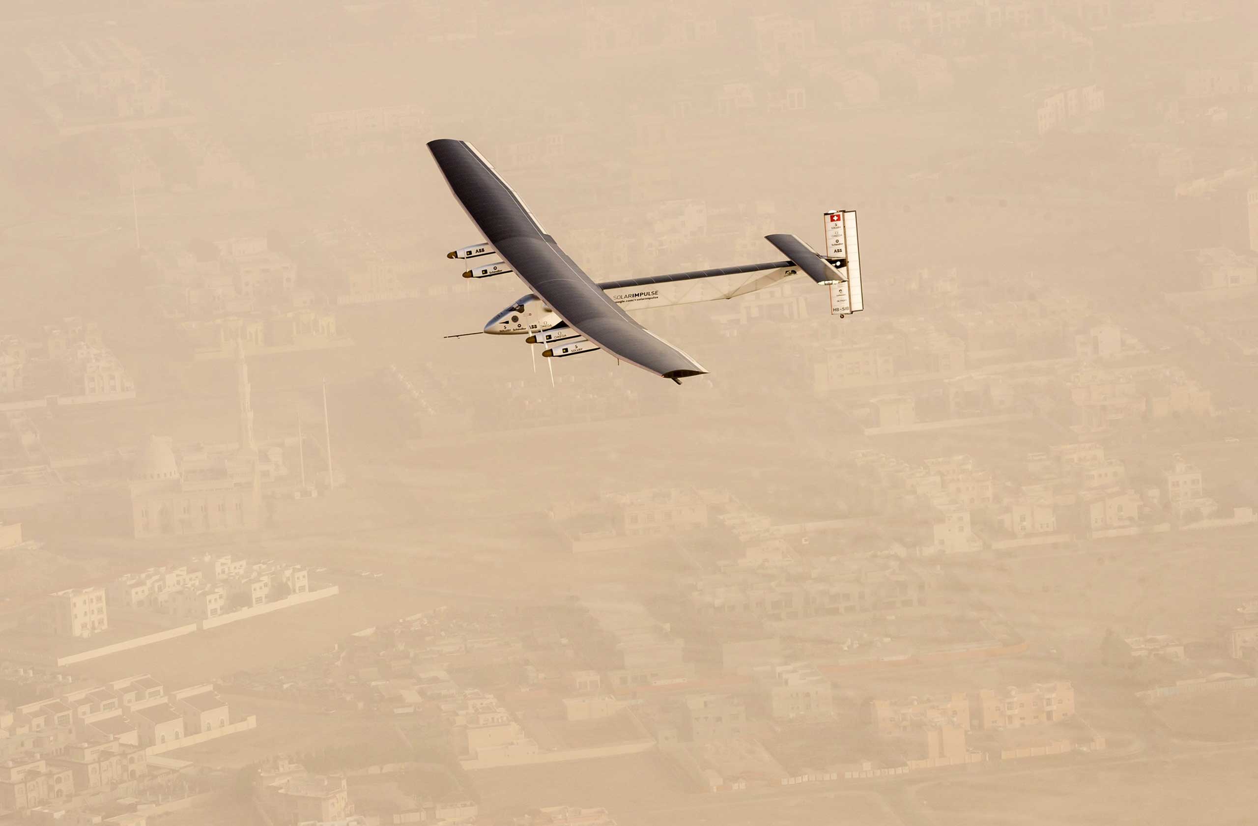 Solar Impulse 2, a solar-powered airplane, takes flight as it begins its historic round-the-world journey from Al Bateen Airport in Abu Dhabi on March 9, 2015.