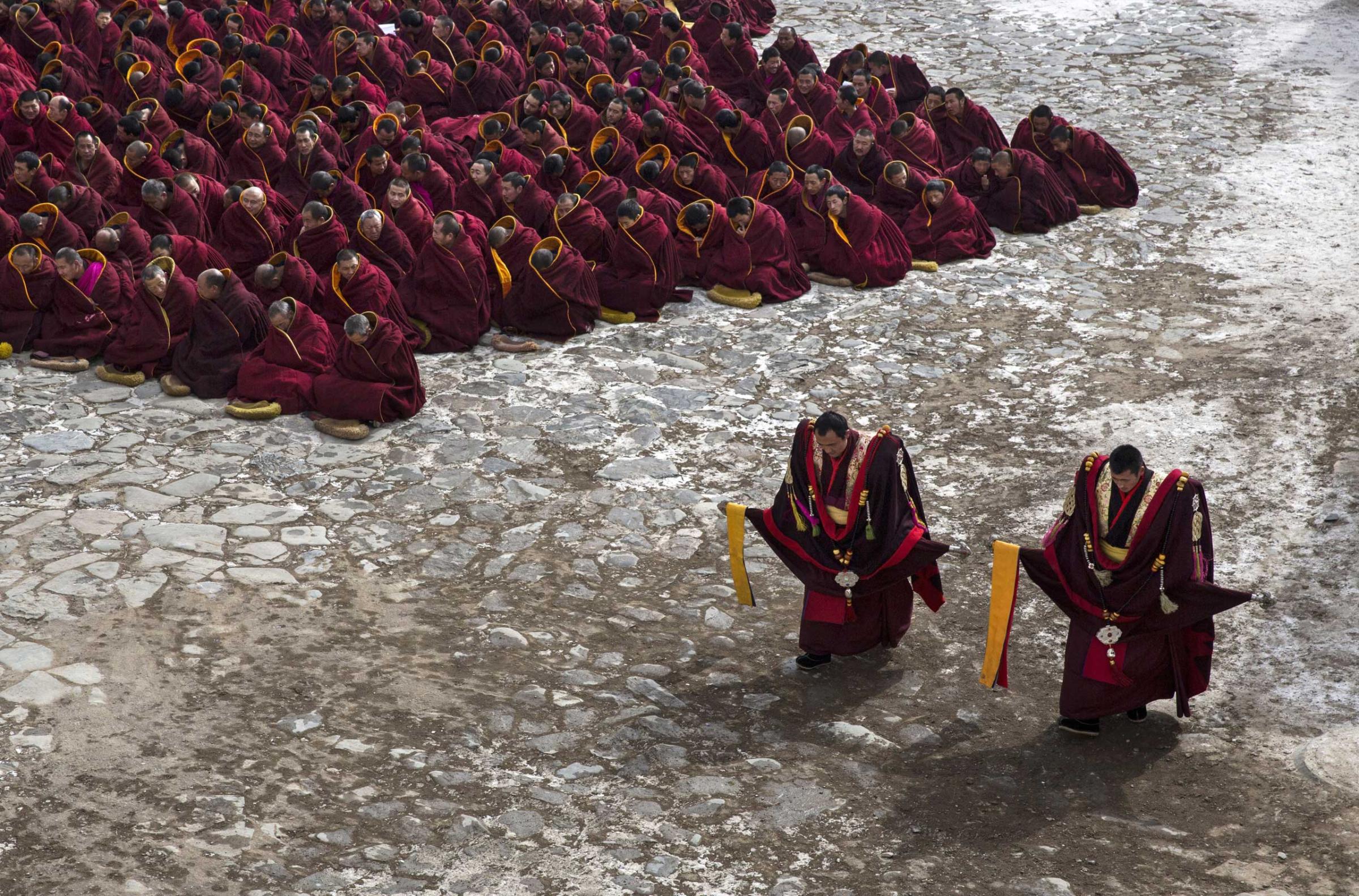 Tibetan Buddhist monks take part in a special prayer during Monlam or the Great Prayer rituals on March 5, 2015 at the Labrang Monastery.