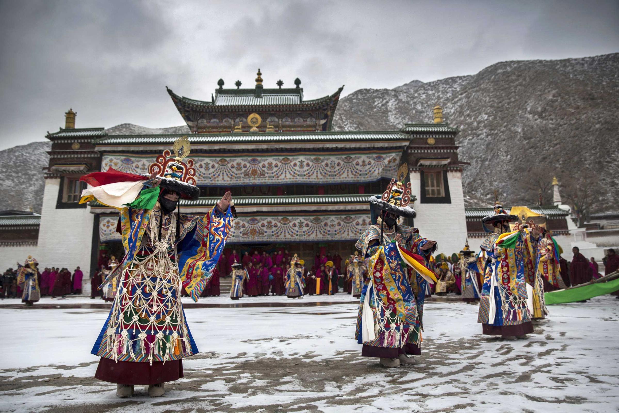 Tibetan Buddhist monks perform a black hat dance during Monlam or the Great Prayer rituals on March 4, 2015 at the Labrang Monastery.