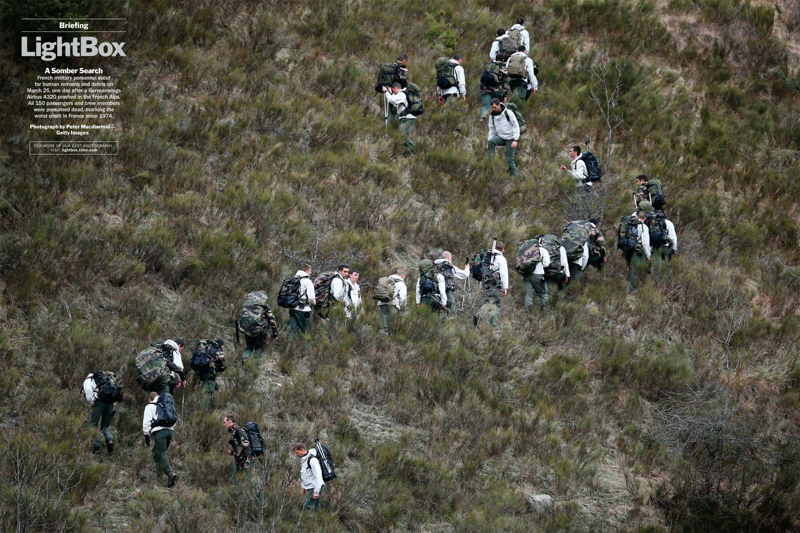 Photograph by Peter Macdiarmid—Getty ImagesFrench military personnel scout for human remains and debris on March 25, one day after a Germanwings Airbus A320 crashed in the French Alps. All 150 passengers and crew members were presumed dead, marking the worst crash in France since 1974. (TIME issue April 6, 2015)