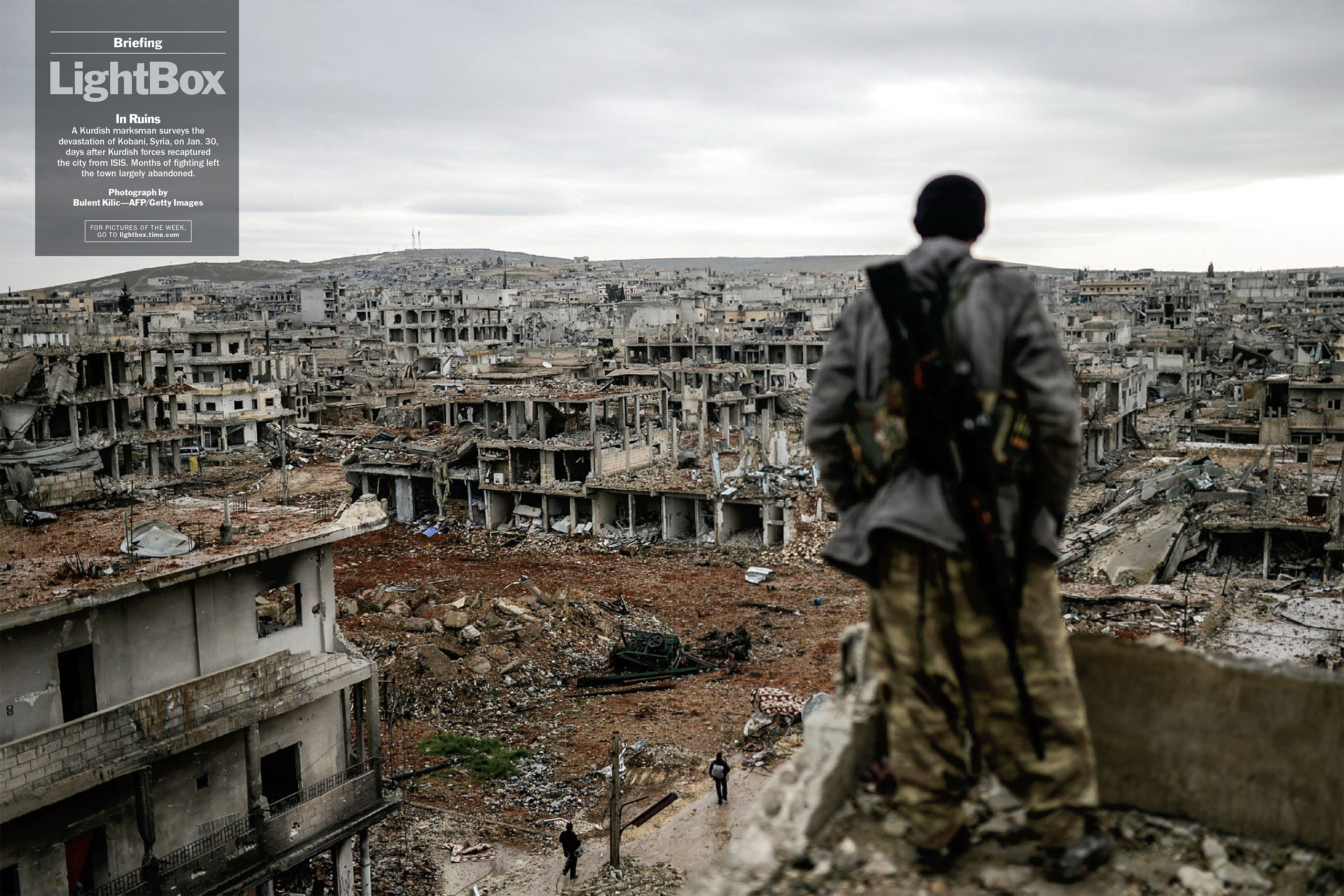 Photograph by Bulent Kilic—AFP/Getty ImagesA Kurdish marksman surveys the devastation of Kobani, Syria, on Jan. 30, days after Kurdish forces recaptured the city from ISIS. Months of fighting left the town largely abandoned. (TIME issue February 16, 2015)