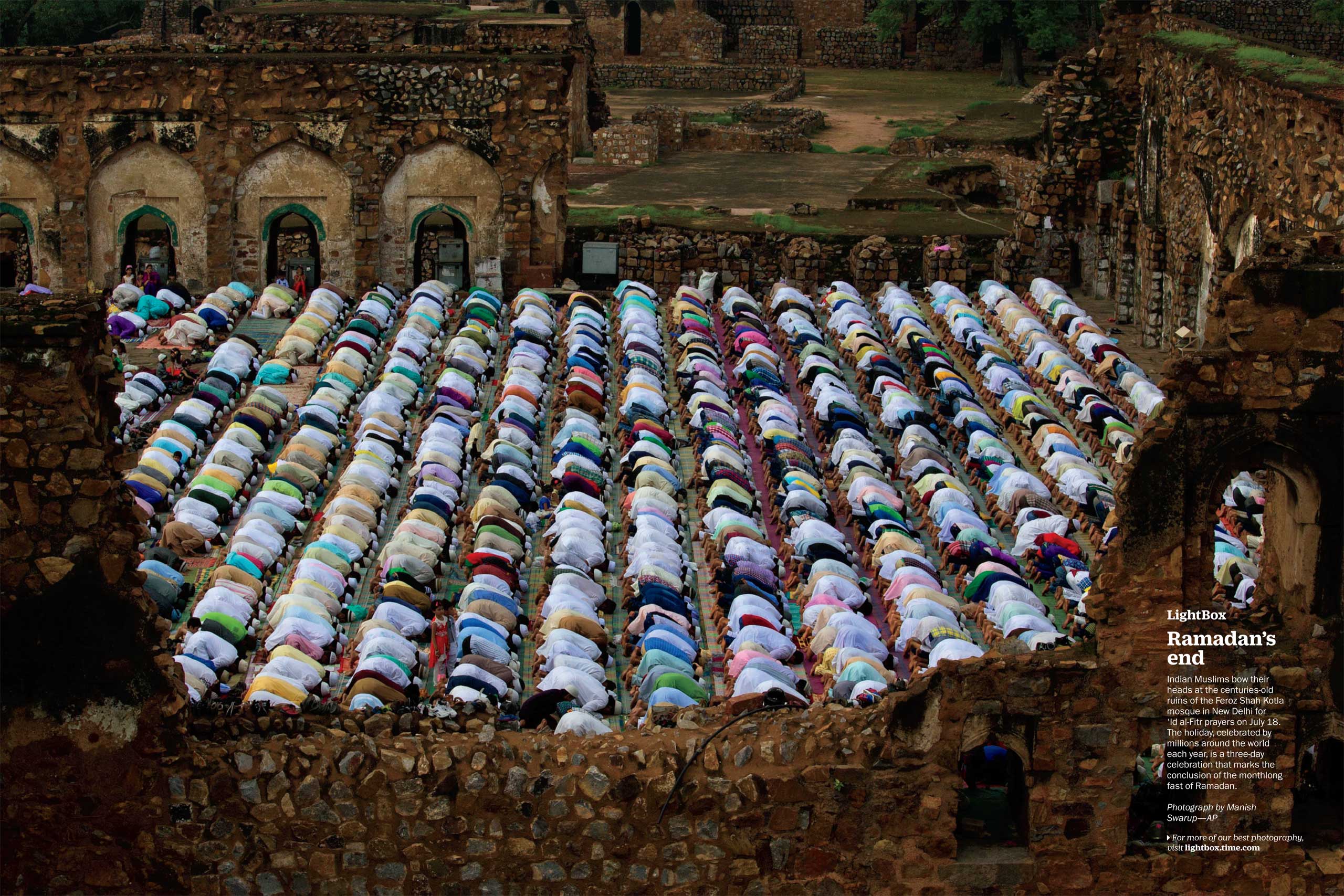 Photograph by Manish Swarup—APIndian Muslims bow their heads at the centuries-old ruins of the Feroz Shah Kotla mosque in New Delhi for 'Id al-Fitr prayers on July 18. The holiday, celebrated by millions around the world each year, is a three-day celebration that marks the conclusion of the monthlong fast of Ramadan. (TIME issue August 3, 2015)