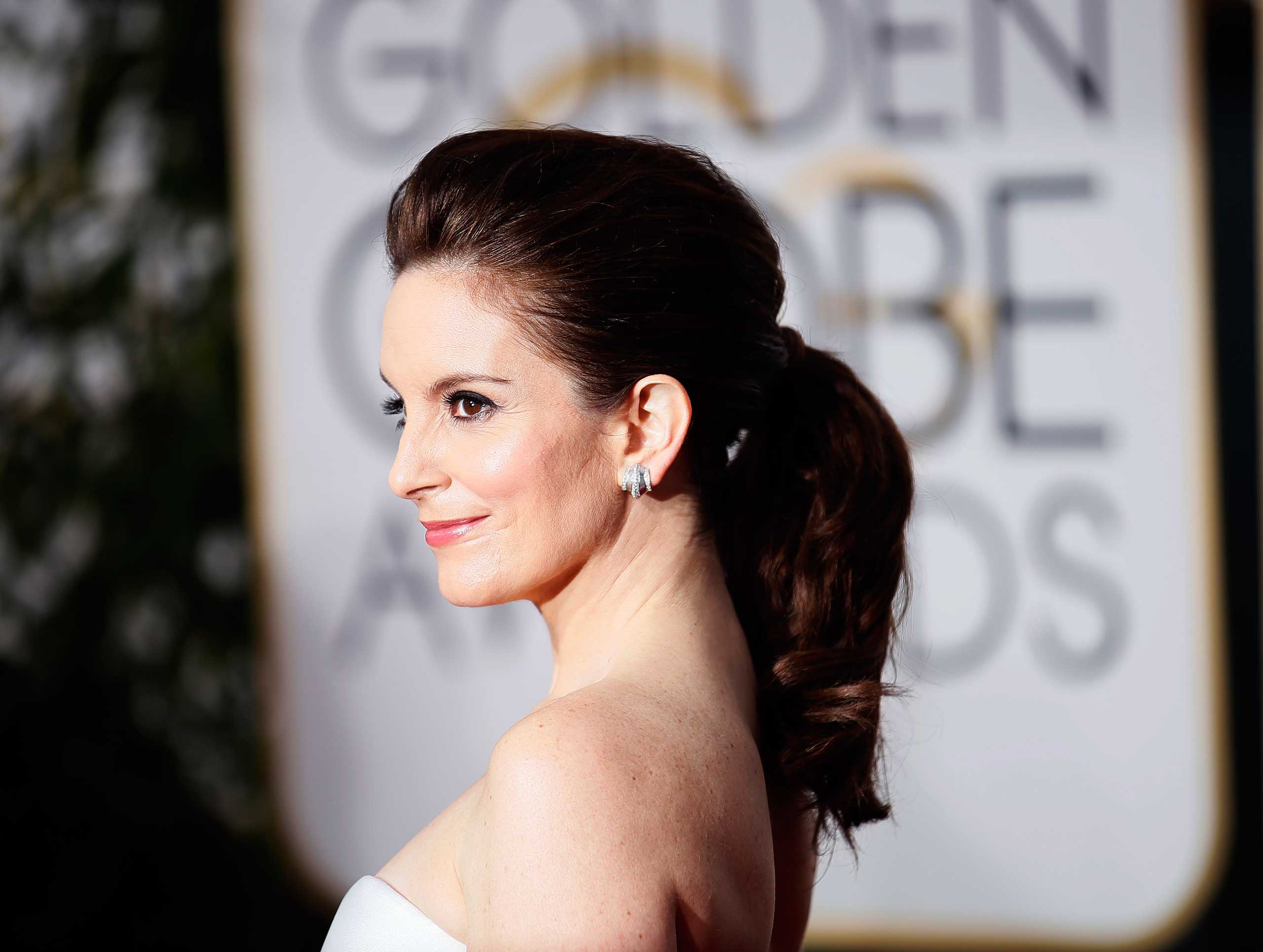 Tina Fey arrives at the 72nd Golden Globe Awards in Beverly Hills, California, Jan. 11, 2015. (Danny Moloshok—Reuters)
