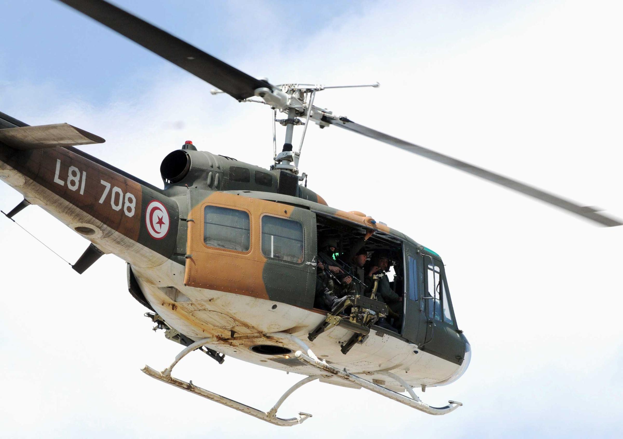 A Tunisian security force helicopter flies over the site of an attack carried out by two gunmen at the National Bardo Museum on March 18, 2015 in Tunis.