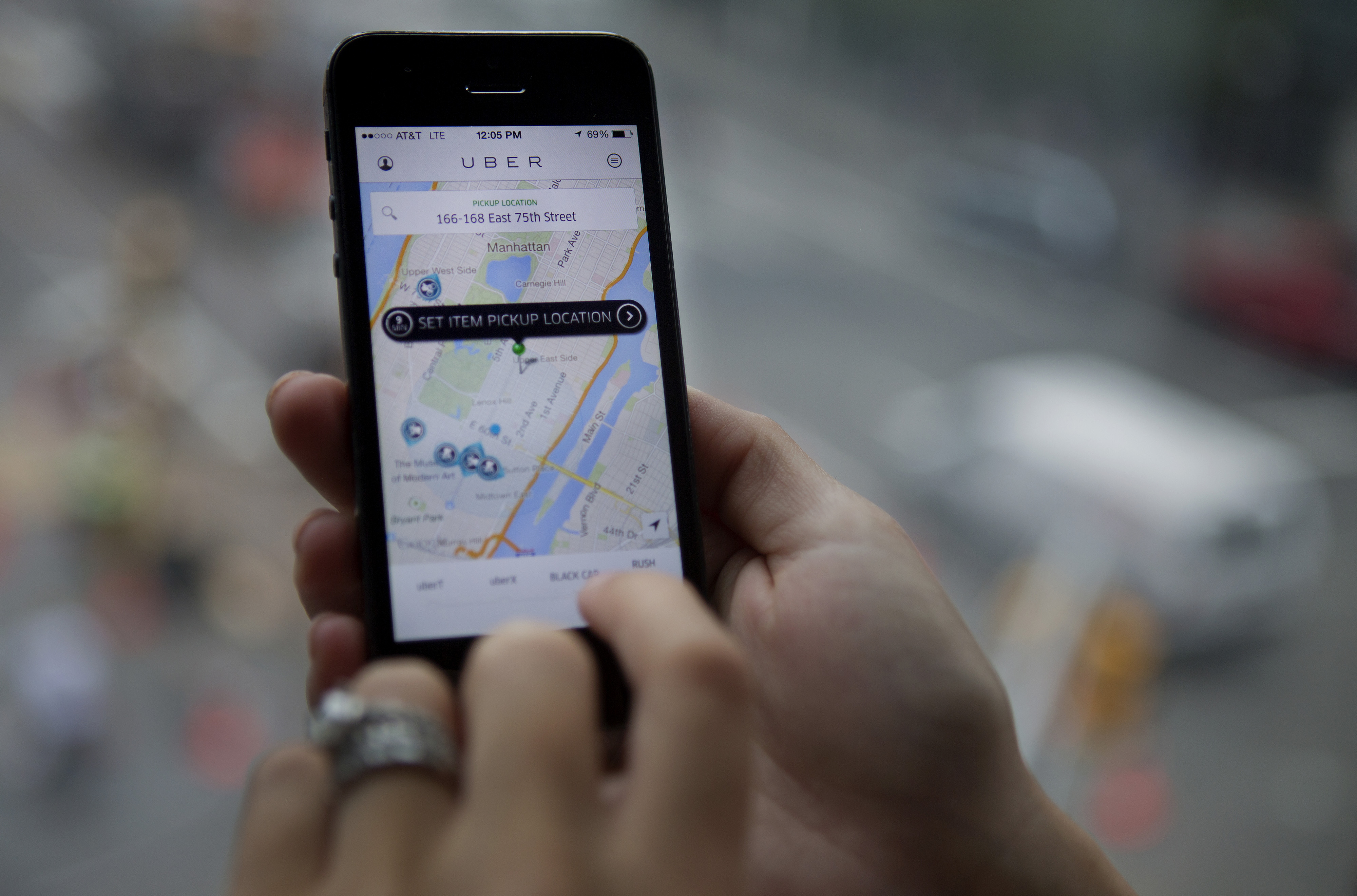 The Uber app is demonstrated for a photograph on an iPhone in New York City on Aug. 6, 2014 (Bloomberg via Getty Images)