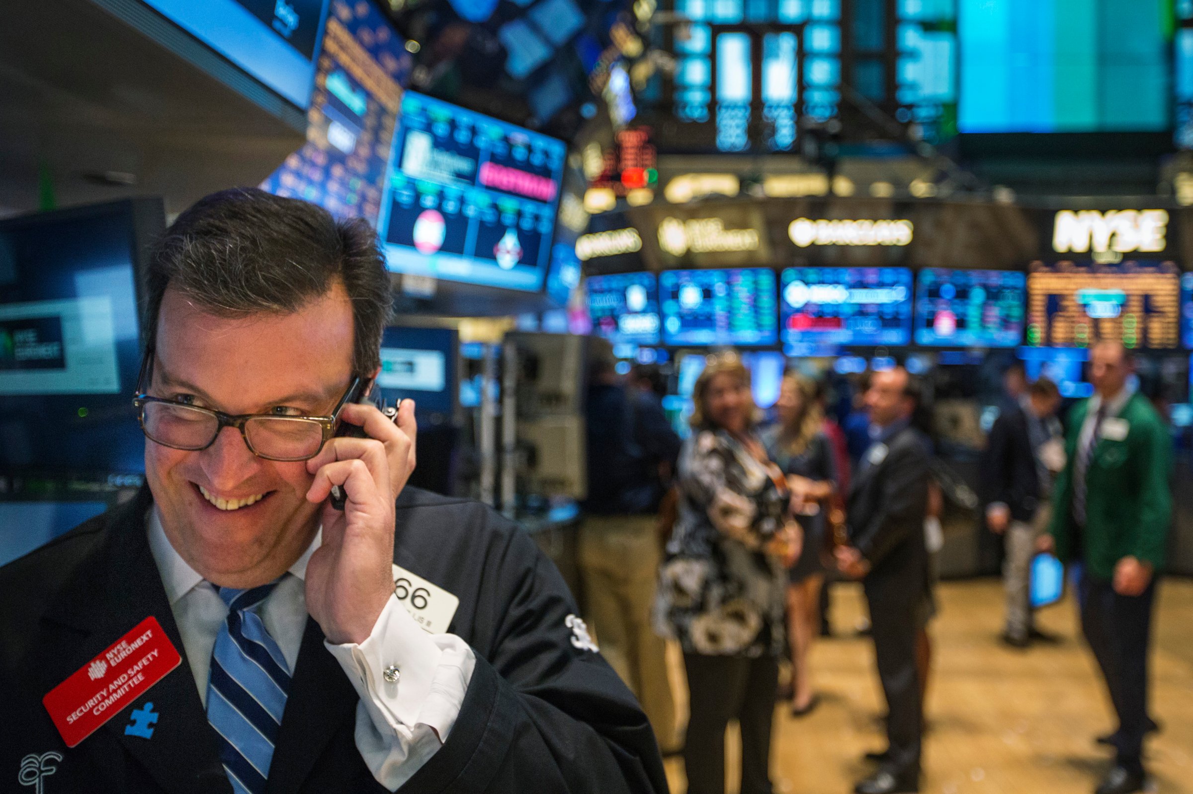 A trader works on the floor of the New York Stock Exchange shortly before the end of the day's trading in New York July 31, 2013