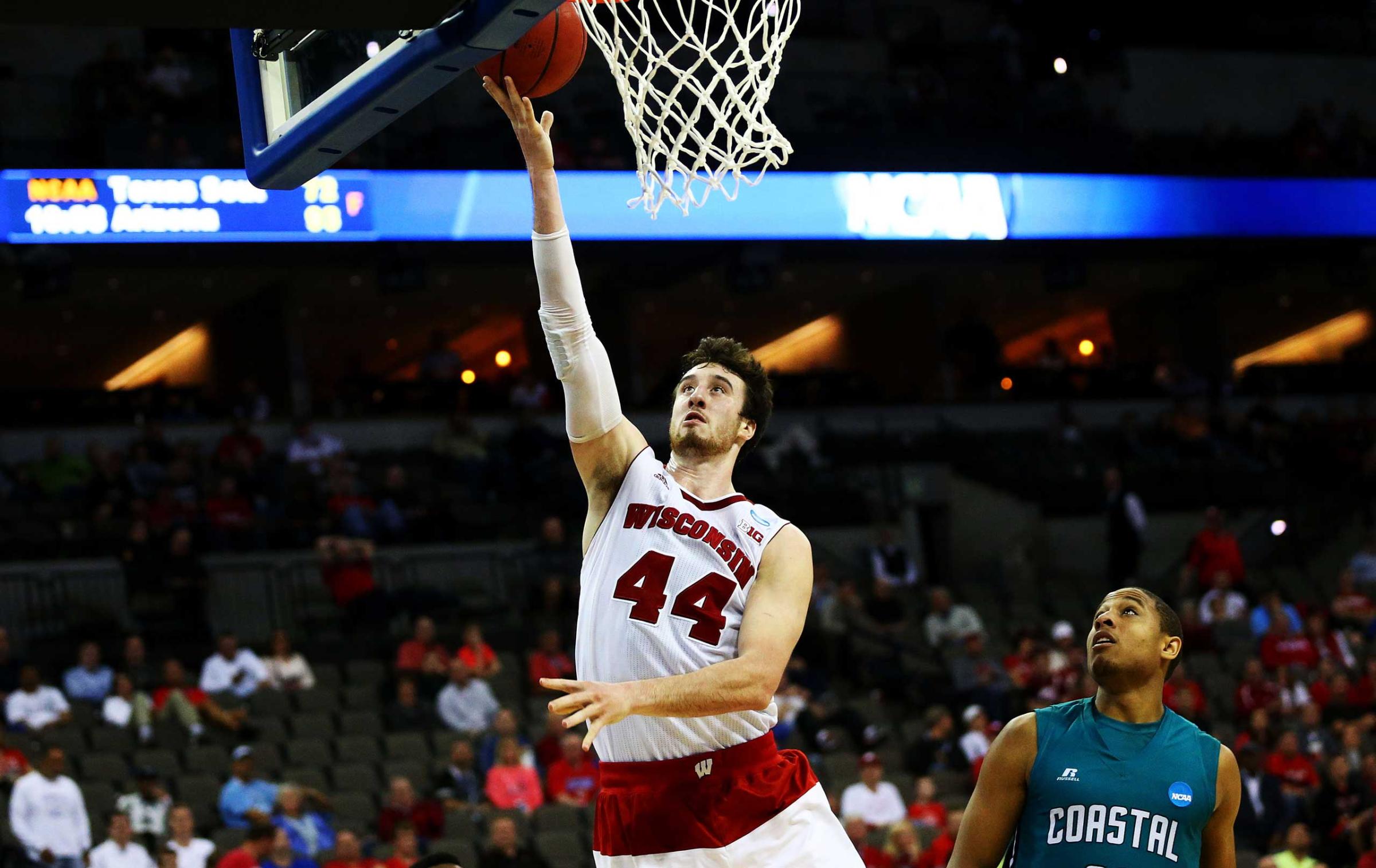 Frank Kaminsky of the Wisconsin Badgers shoots against the Coastal Carolina Chanticleers in the second half during the second round of the 2015 NCAA Men's Basketball Tournament at the CenturyLink Center in Omaha, Neb. on March 20, 2015.