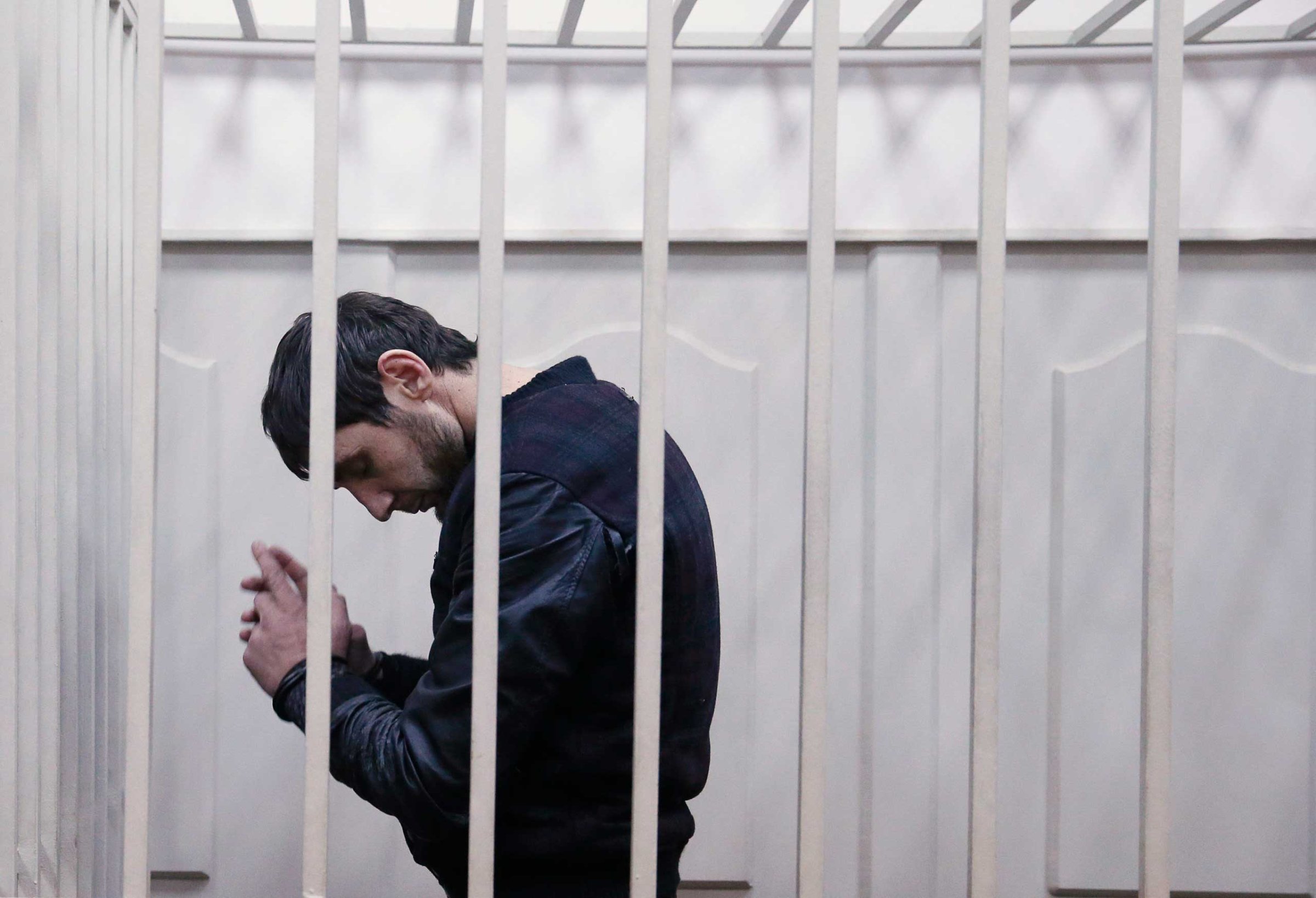 Zaur Dadayev, charged over the killing of Russian opposition figure Boris Nemtsov, stands inside a defendants' cage inside a court building in Moscow, March 8, 2015.