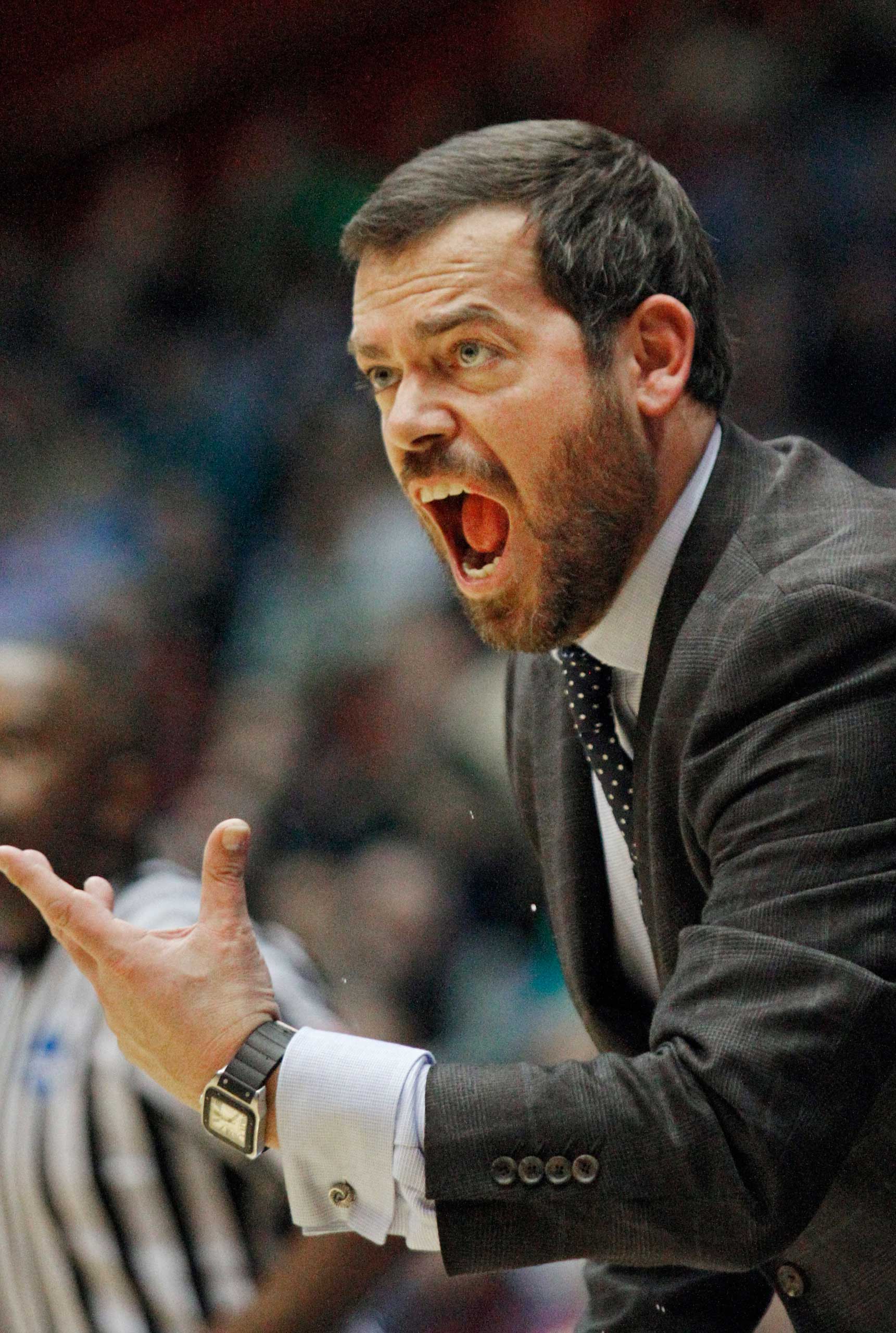 Manhattan coach Steve Masiello yells from the sidelines in the first half of a first-round NCAA tournament basketball game against Hampton, in Dayton, Ohio, March 17, 2015.