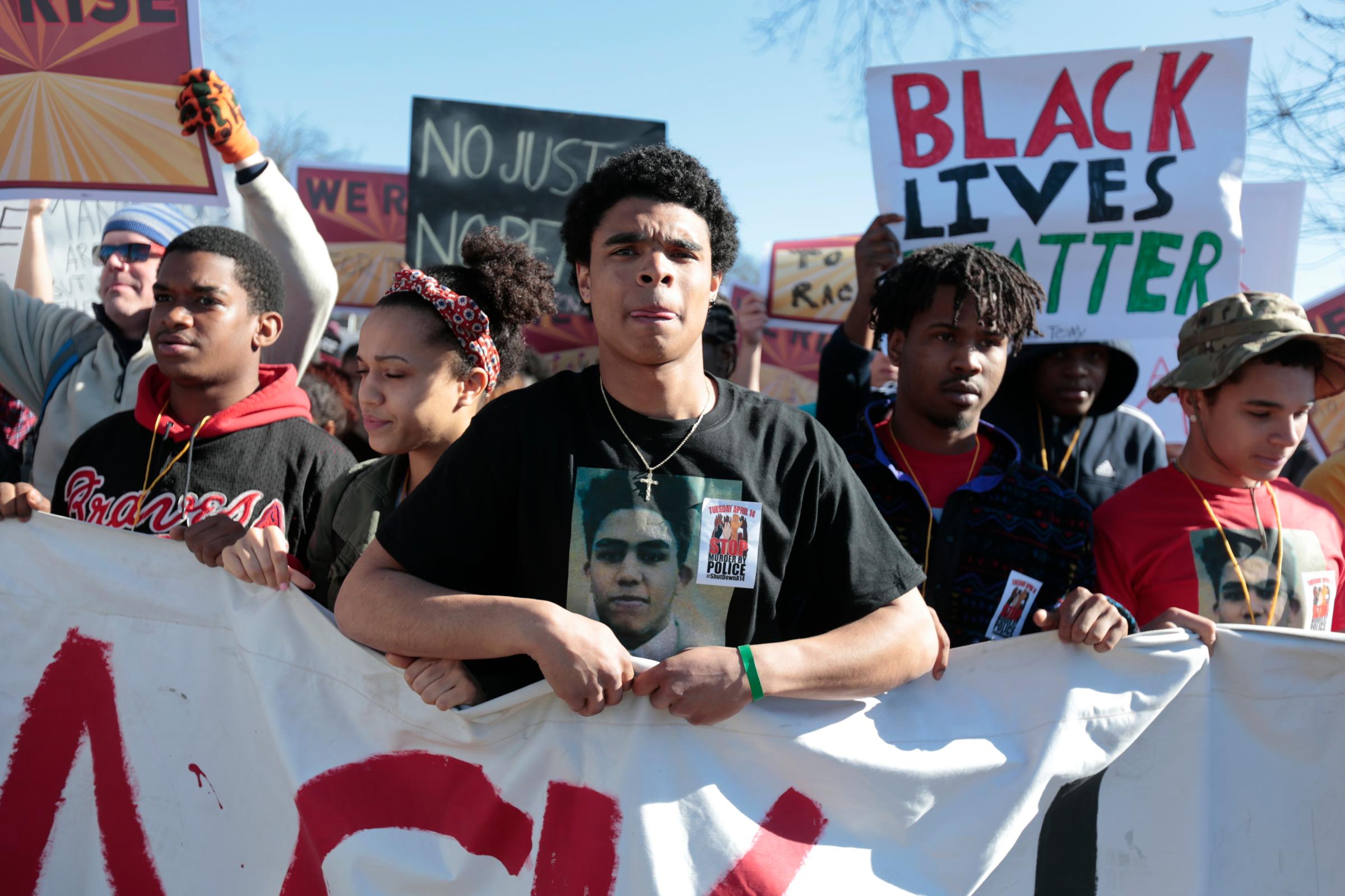 Demonstrators prepare to march in protest against the fatal police shooting of Tony Robinson in Madison, Wis. on March 11, 2015.
