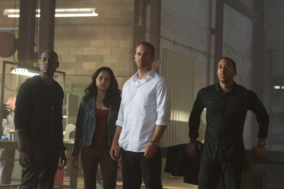 Tyrese Gibson, Jordana Brewster, Paul Walker, and Ludacris in FURIOUS 7. (Universal Pictures)