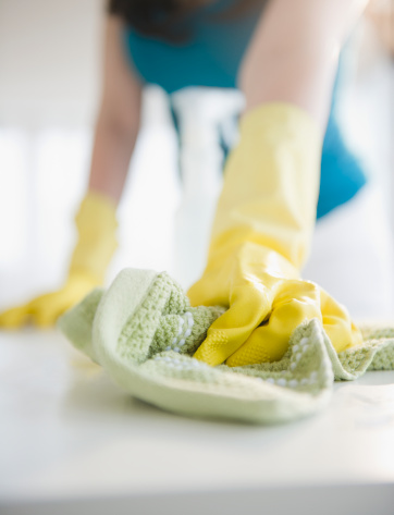 close-up-woman-cleaning-counter