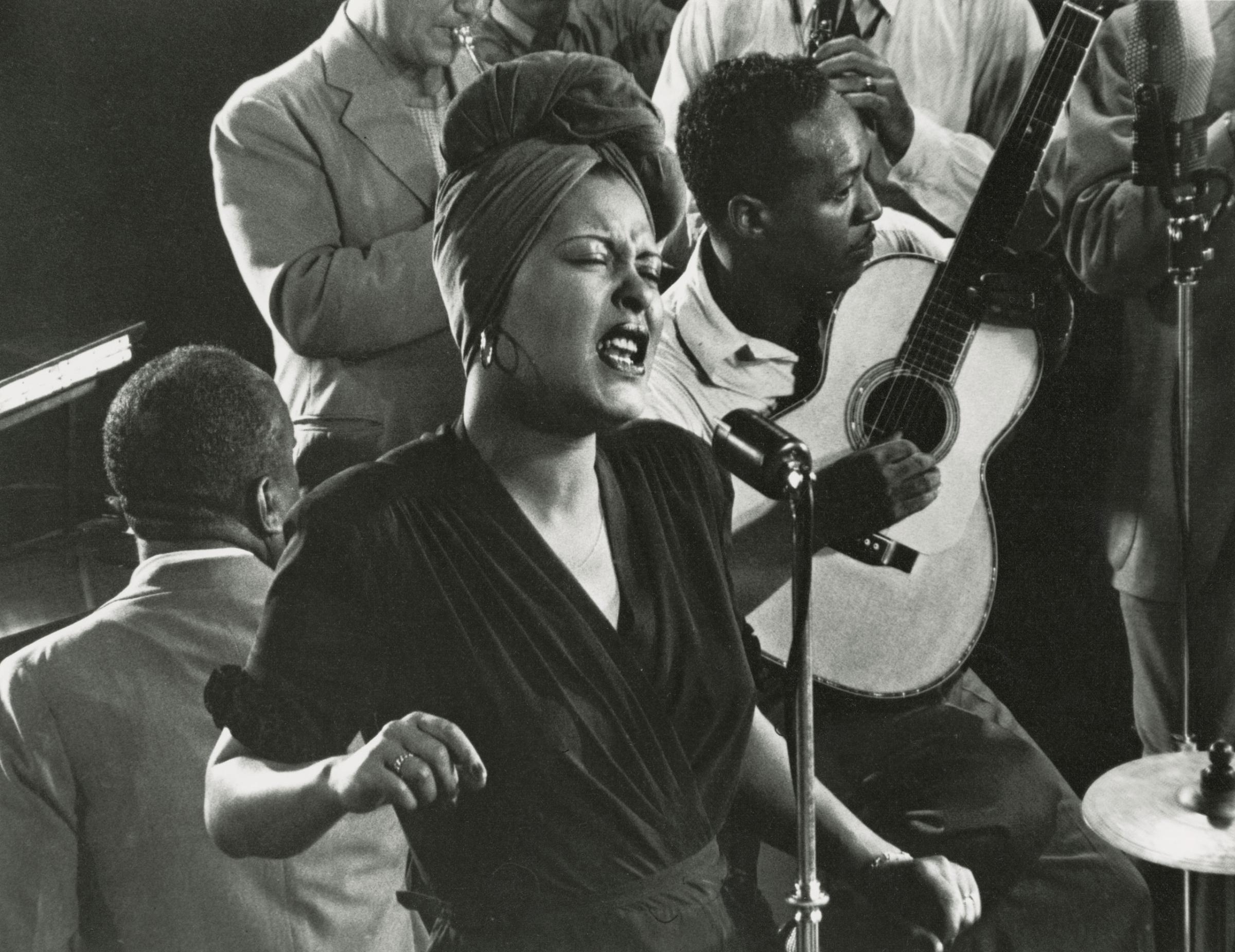 Billie Holiday singing "Fine & Mellow" accompanied by James P. Johnson at piano.